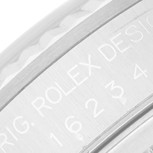 The image shows a close-up of the inner engravings on the case of a Rolex Datejust 16234 Men's Stainless Steel Silver Dial 16234 Men's Stainless Steel Silver Dial watch.
