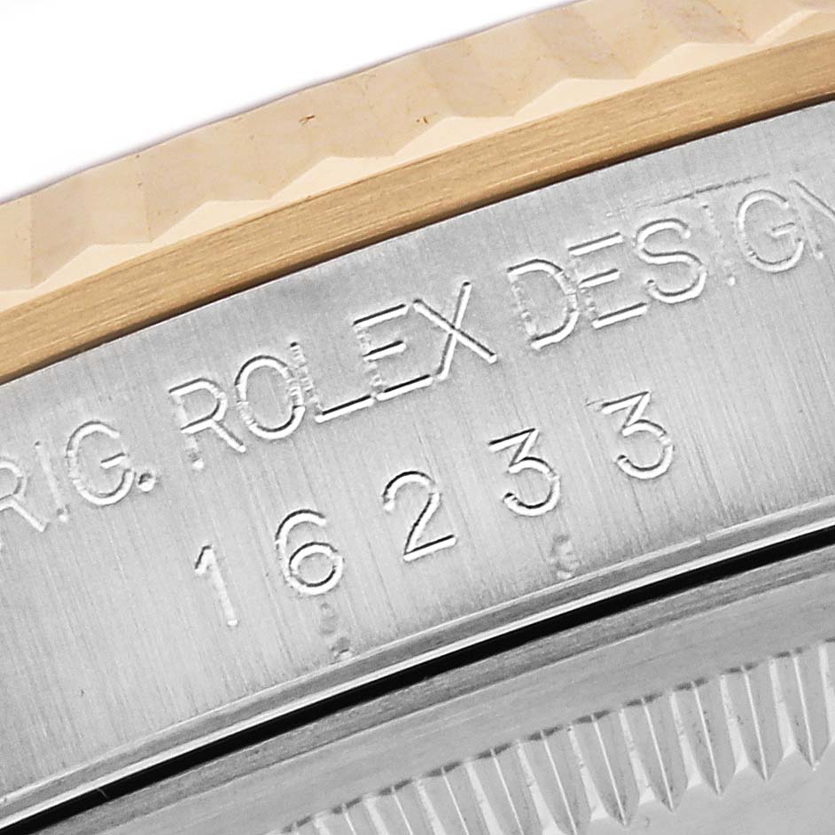 This image shows a close-up angle of the model and design number engraved on the Rolex Datejust 16233 Men's Steel and Gold (two tone) Black Dial 16233 Men's Steel and Gold (two tone) Black Dial watch bezel.