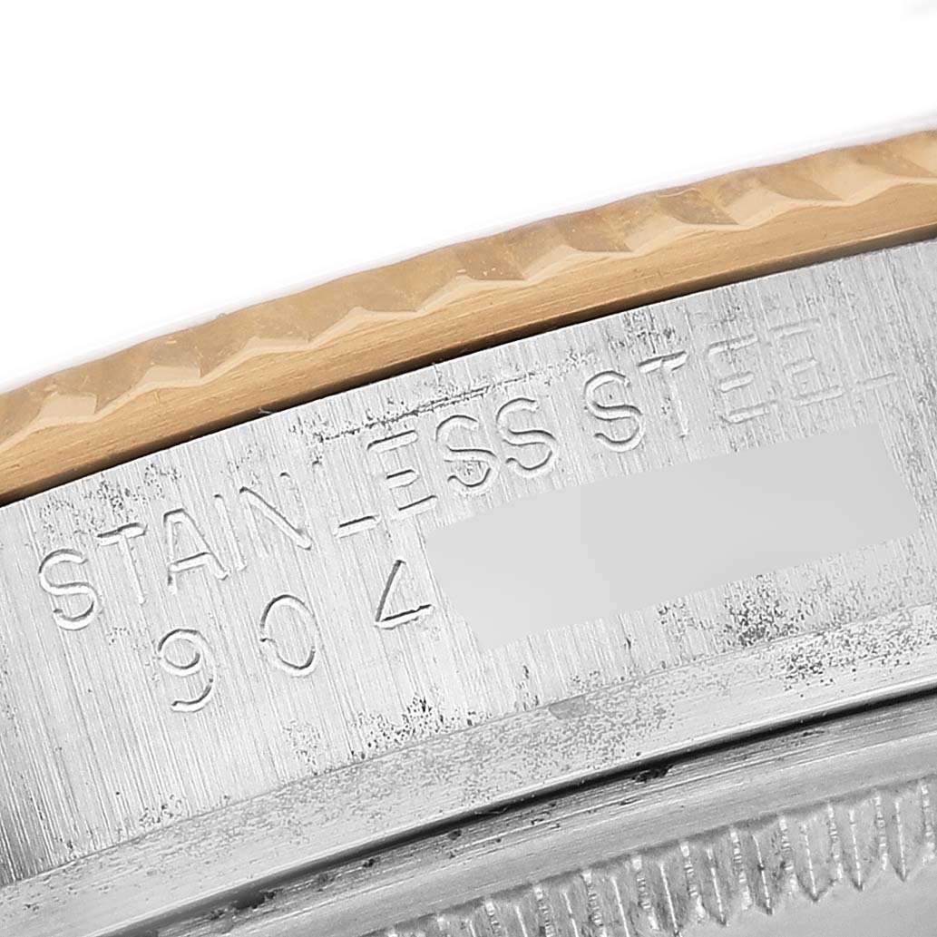 The image shows a close-up of the Rolex Datejust 16013 Men's Steel and Gold (two tone) Champagne Dial's side edge, highlighting the "Stainless Steel" engraving.