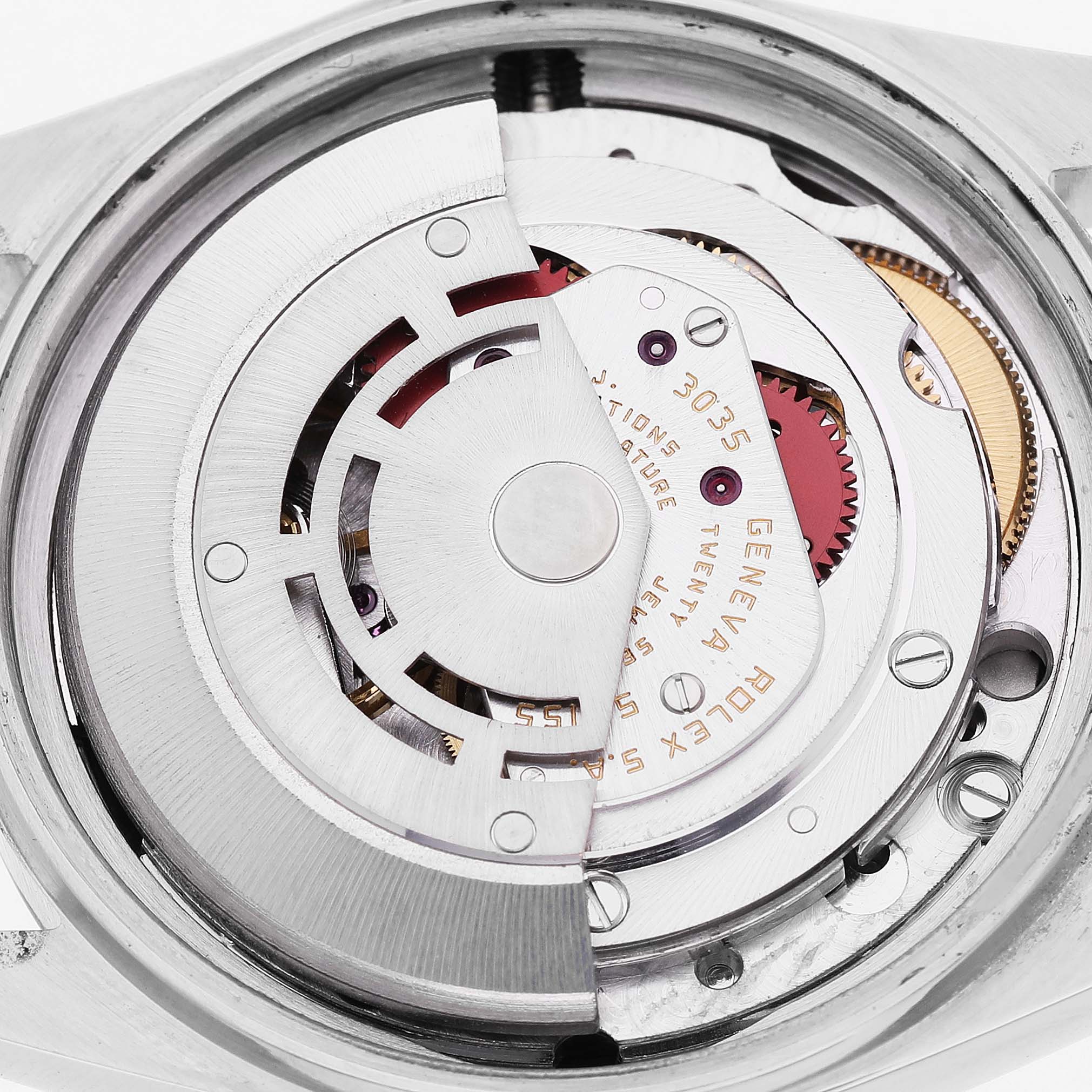 The image shows the movement mechanism of a Rolex Datejust 16013 Men's Steel and Gold (two tone) Champagne Dial watch from a top-down angle, highlighting its intricate details.