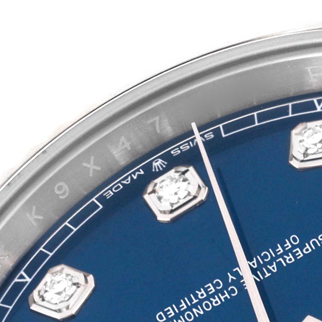 This image shows a close-up angle of the dial, bezel, and diamond hour markers of a Rolex Datejust 41 126334 Men's Stainless Steel Blue Dial 126334 Men's Stainless Steel Blue Dial watch.