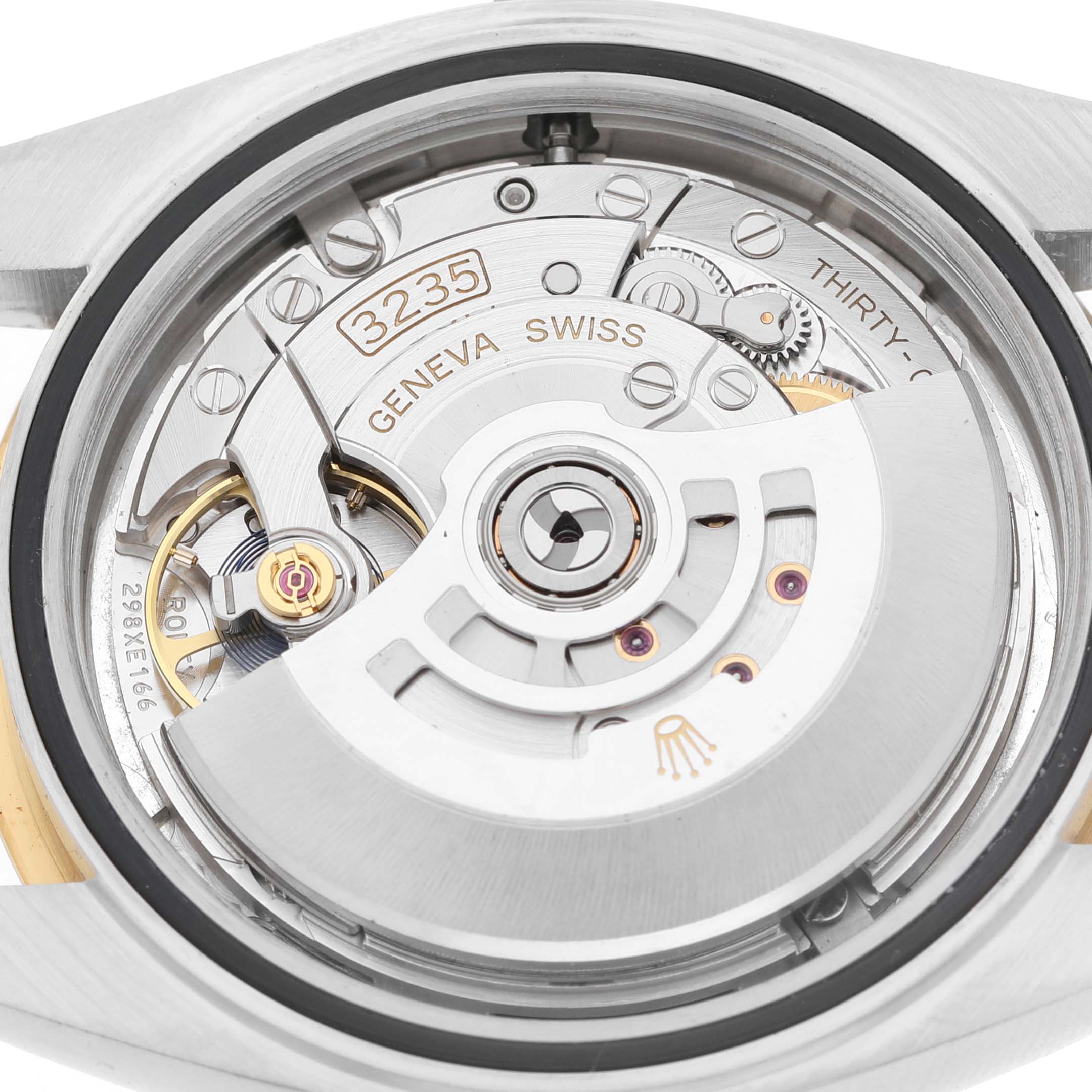 The image shows a close-up view of the Rolex Datejust 41 126333 Men's Steel and Gold (two tone) Silver Dial's movement, focusing on the inner mechanism.