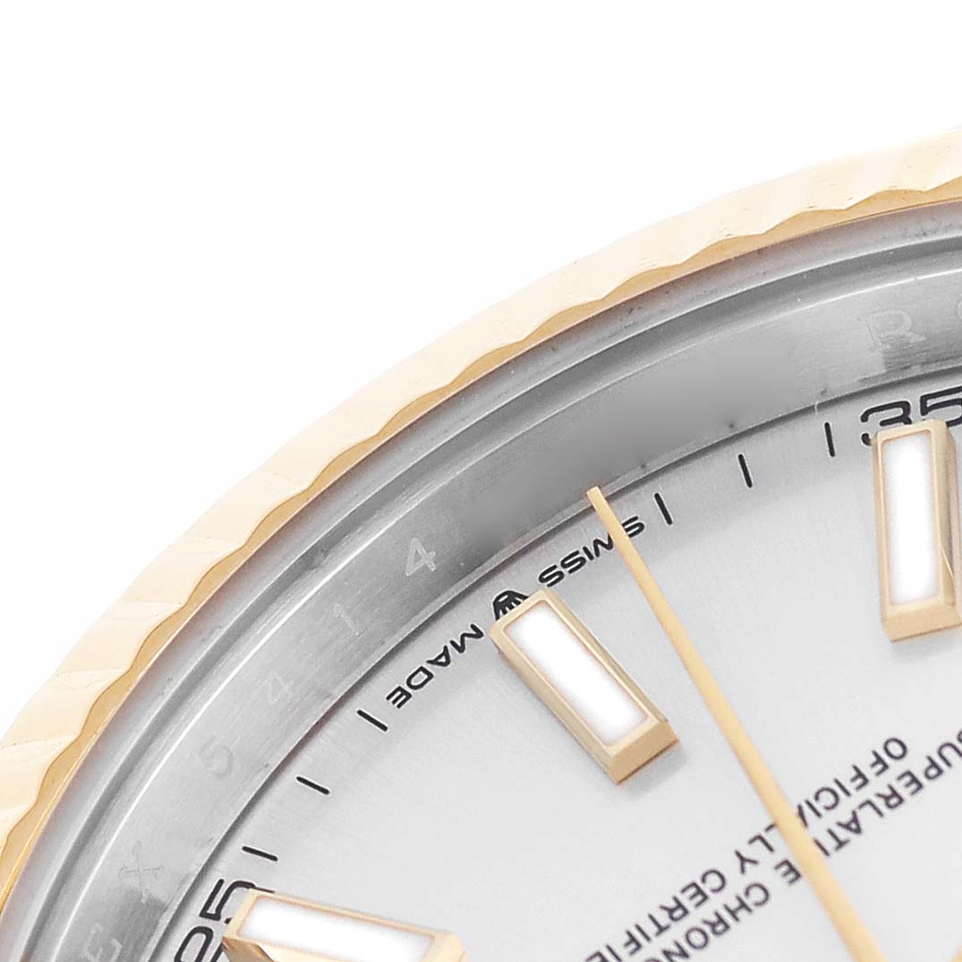 The image shows a close-up of the dial and fluted bezel of a Rolex Datejust 41 126333 Men's Steel and Gold (two tone) Silver Dial, highlighting hour markers and part of the minute track.