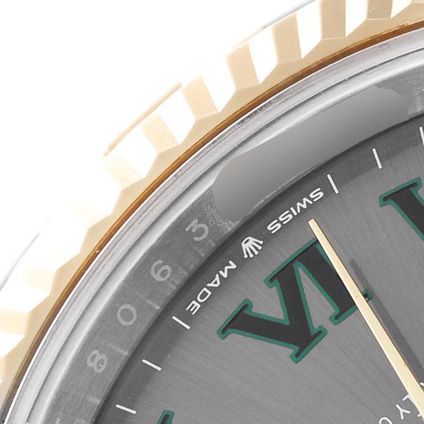The image shows a close-up of the bezel, part of the dial, and a section of the inner ring of the Rolex Datejust 41 126333 Men's Steel and Gold (two tone) Grey Dial 126333 Men's Steel and Gold (two tone) Grey Dial.