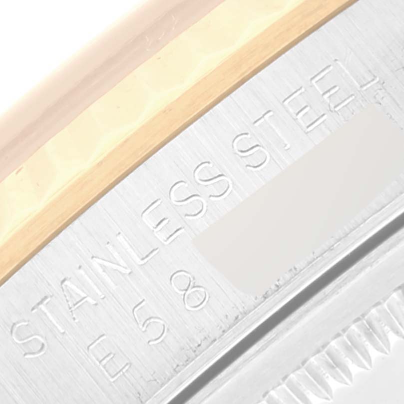 This image shows a close-up of the side engraving on a Rolex Datejust 16233 Men's Steel and Gold (two tone) Champagne Dial 16233 Men's Steel and Gold (two tone) Champagne Dial model watch, highlighting "STAINLESS STEEL".