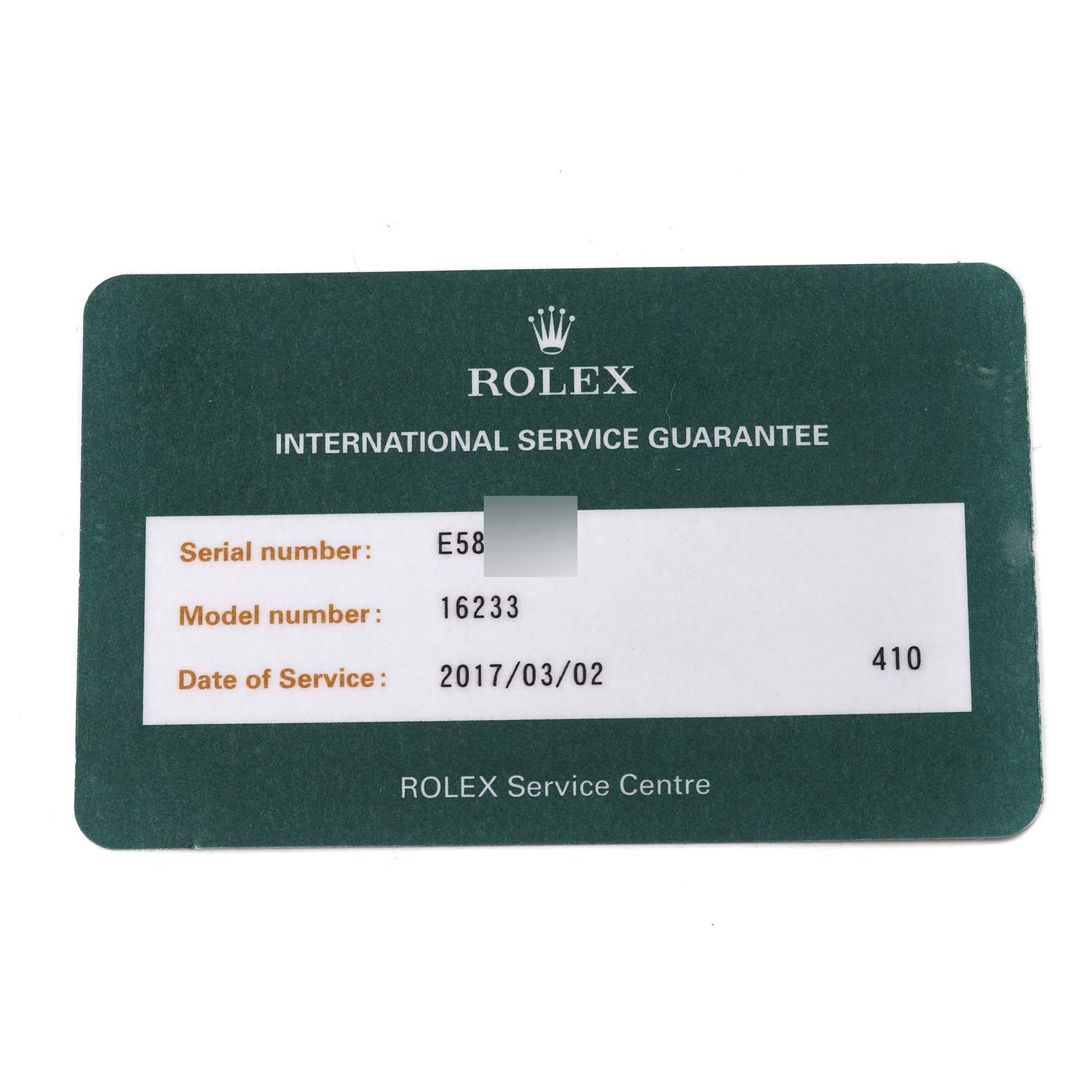 The image shows a green Rolex International Service Guarantee card for the Datejust model, including the model number and service date.