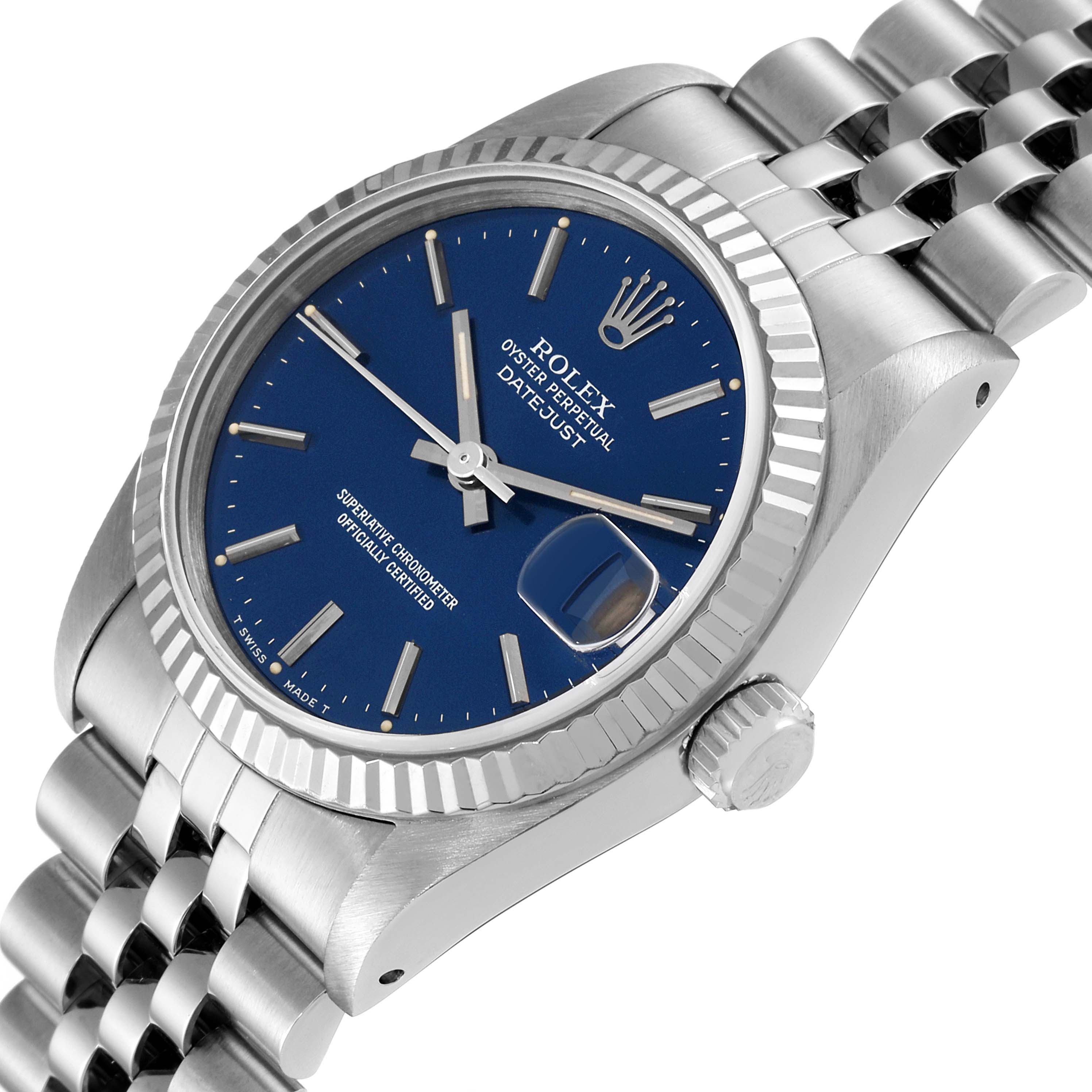 The image shows a close-up of a Rolex Mid-Size 68274 Women
s Stainless Steel Blue Dial 68274 Women
s Stainless Steel Blue Dial Datejust watch, displaying the face, fluted bezel, crown, and part of the bracelet.
