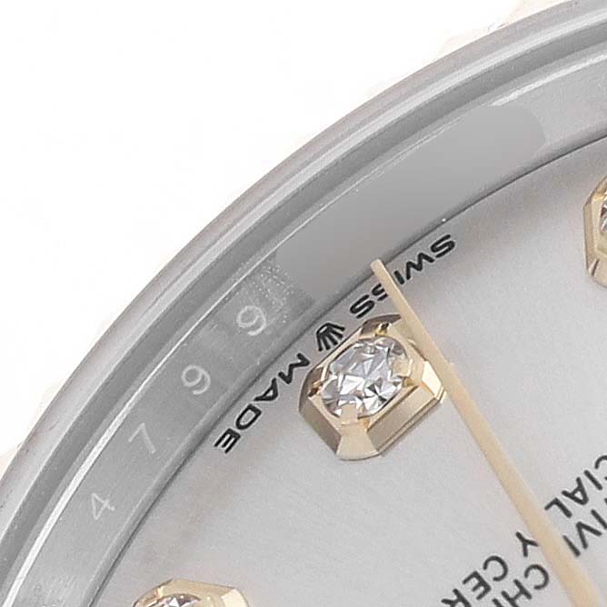 The image shows a close-up of the dial edge with a diamond marker and part of the "Swiss Made" text on a Rolex Mid-Size 278273 Women's Steel and Gold (two tone) Silver Dial model.
