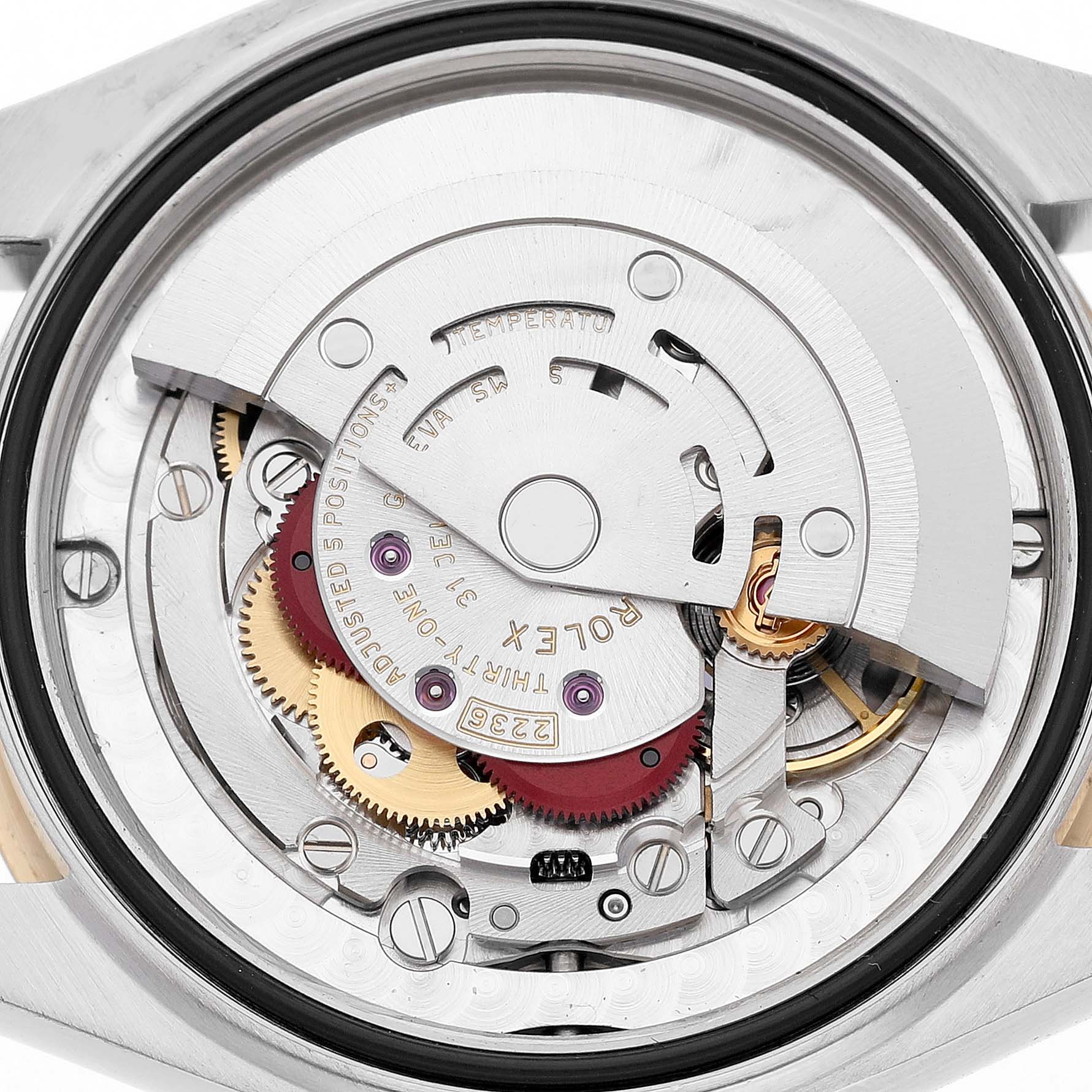 The image shows the movement of a Rolex Mid-Size 278273 Women's Steel and Gold (two tone) Silver Dial model watch from a top-down view, highlighting its intricate internal components.