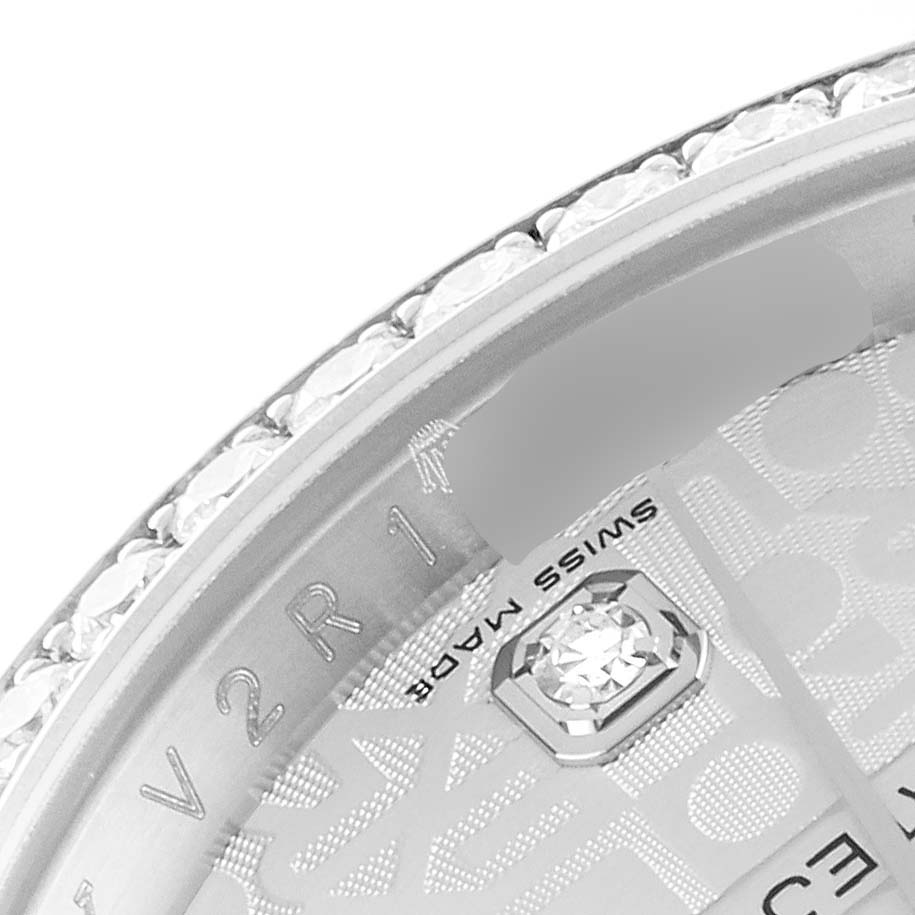 This image shows a close-up of the bezel and part of the dial of a Rolex Datejust 116244 Men's Stainless Steel Silver Dial 116244 Men's Stainless Steel Silver Dial watch.