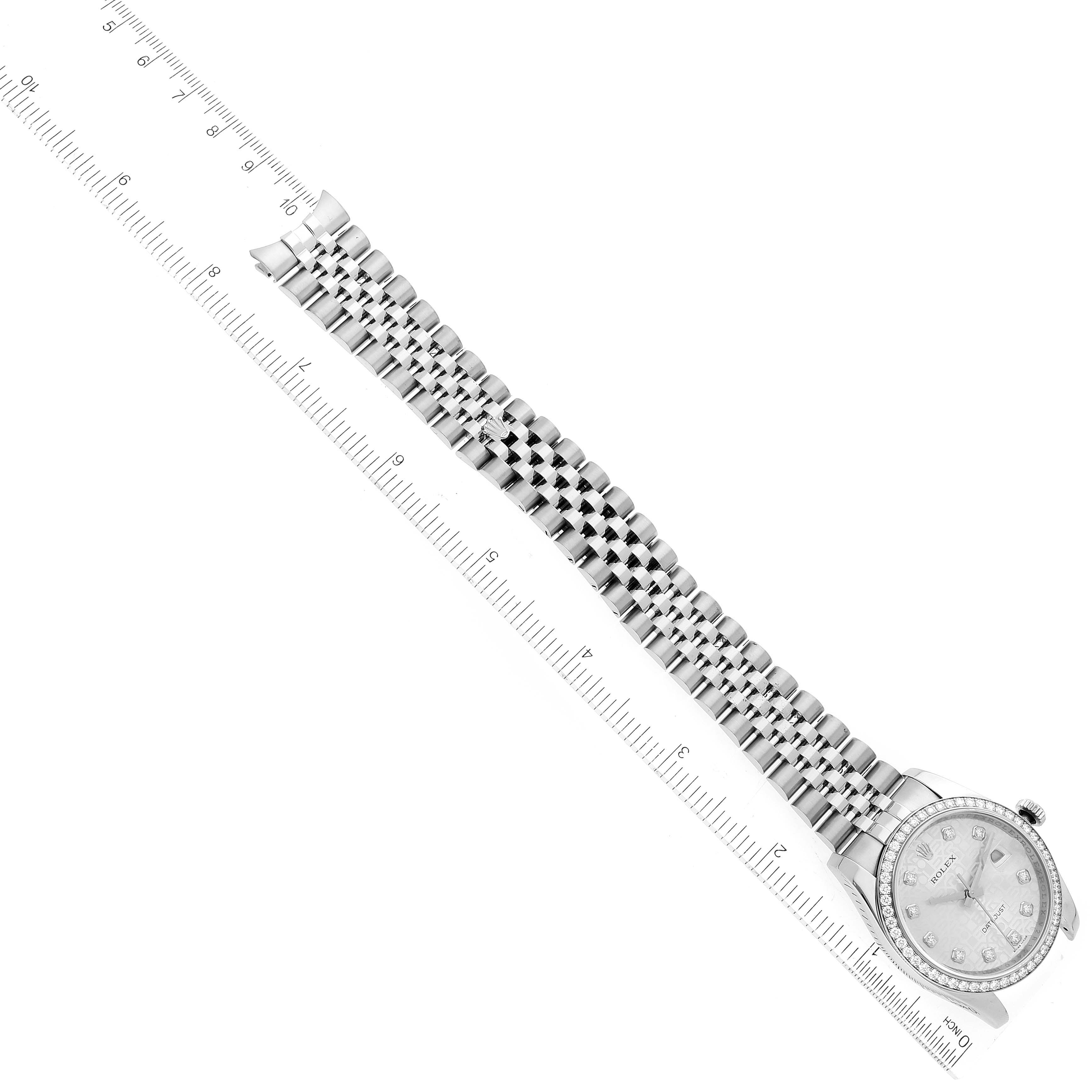 The image shows a Rolex Datejust 116244 Men's Stainless Steel Silver Dial 116244 Men's Stainless Steel Silver Dial watch lying diagonally with a portion of its metal bracelet and a ruler for scale.