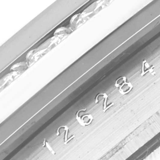 This close-up image shows the serial number engraved on the case of the Rolex Datejust 126284RBR Men's Stainless Steel Mother of Pearl Dial 126284RBR Men's Stainless Steel Mother of Pearl Dial watch.