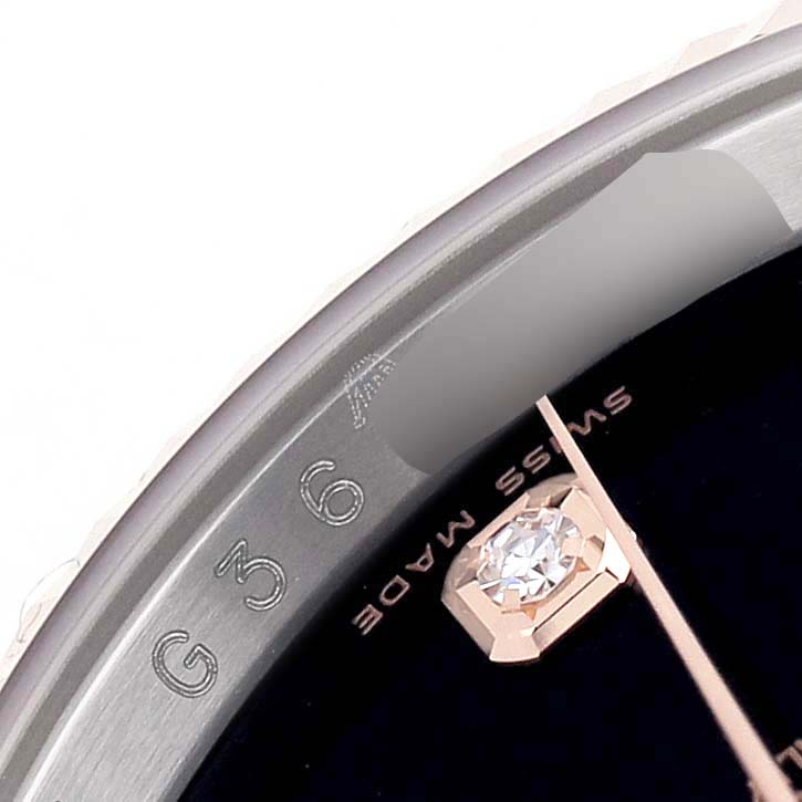 The image shows a close-up of the Rolex Datejust 116231 Men's Steel and Gold (two tone) Black Dial dial with a diamond marker, part of the bezel, and "Swiss Made" text.