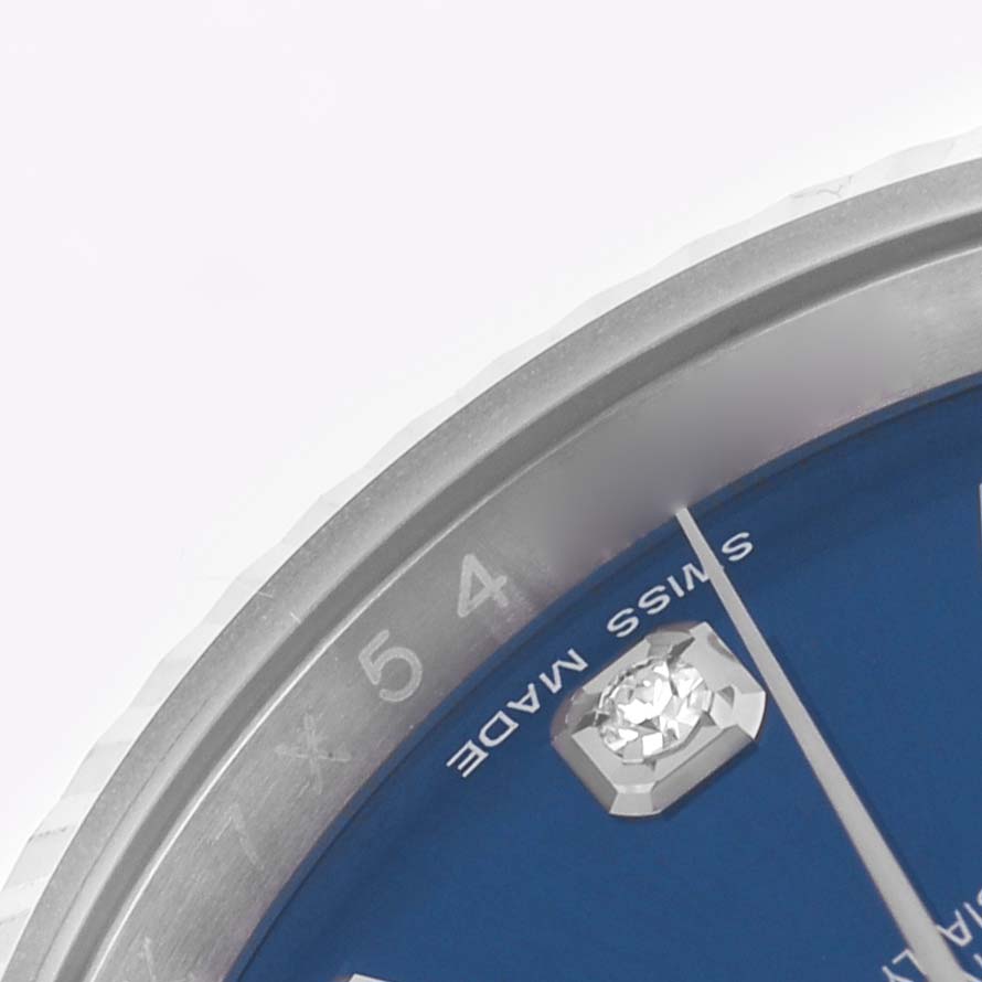 The image shows a close-up of the Rolex Datejust 116234 Men's Stainless Steel Blue Dial, highlighting part of the blue dial, diamond marker, and bezel.