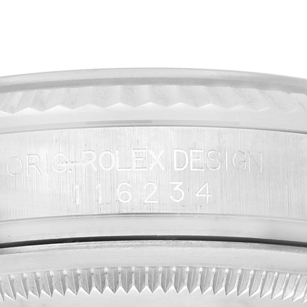 This image shows a close-up of the side of a Rolex Datejust 116234 Men's Stainless Steel Silver Dial 116234 Men's Stainless Steel Silver Dial watch, focusing on the bezel and engraved model number.