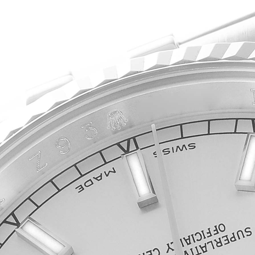 The image shows a close-up of the dial and part of the fluted bezel of a Rolex Datejust 116234 Men's Stainless Steel Silver Dial 116234 Men's Stainless Steel Silver Dial watch.
