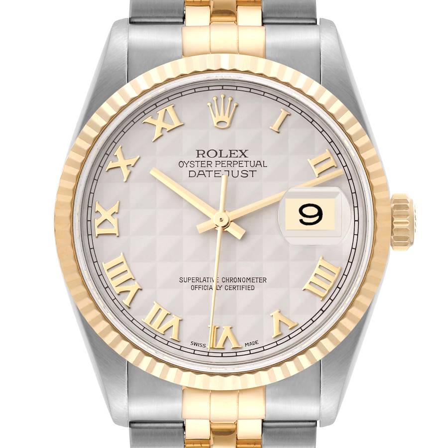 This image shows the face and bezel of a Rolex Datejust watch, focusing on the Roman numerals, date, and two-tone bracelet.