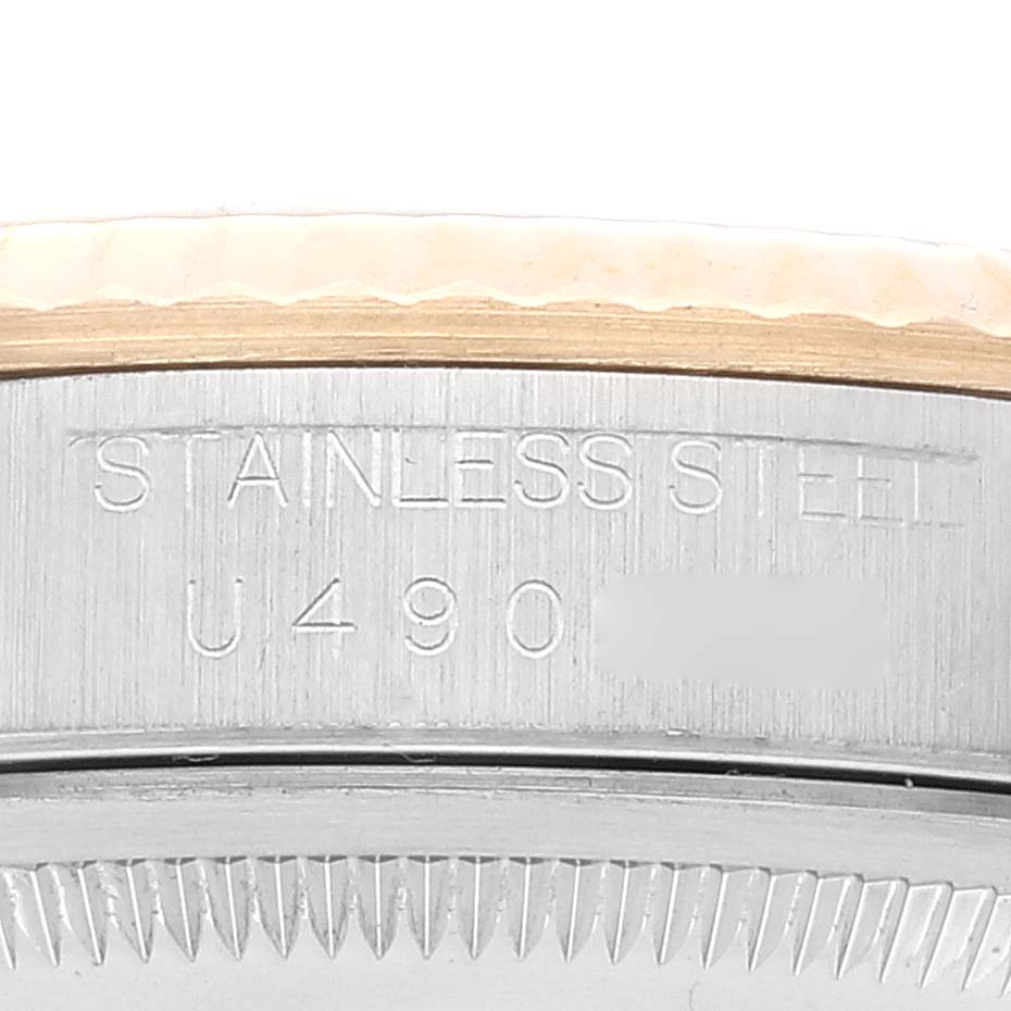 The image shows a close-up of the engraving on the side of a Rolex Datejust 16233 Men's Steel and Gold (two tone) Beige Dial 16233 Men's Steel and Gold (two tone) Beige Dial watch case, highlighting the "Stainless Steel" text.