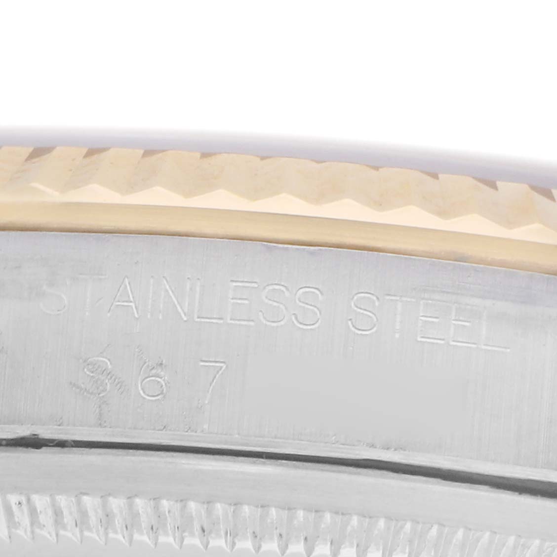 The image shows a close-up of the bezel and side of a Rolex Datejust model 16233, highlighting its stainless steel material and edge details.