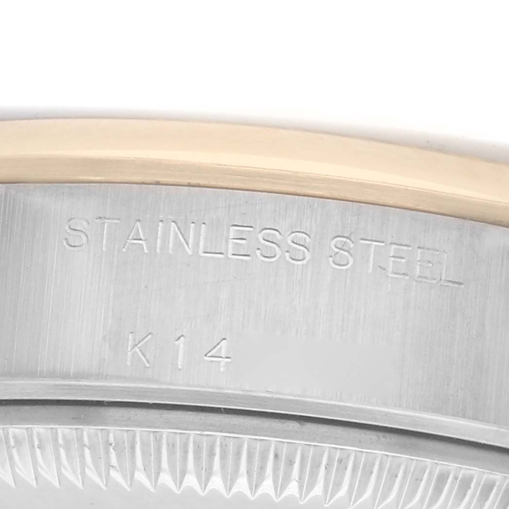 The image shows a close-up of the side of a Rolex Datejust model 79163, highlighting the stainless steel and K14 markings.