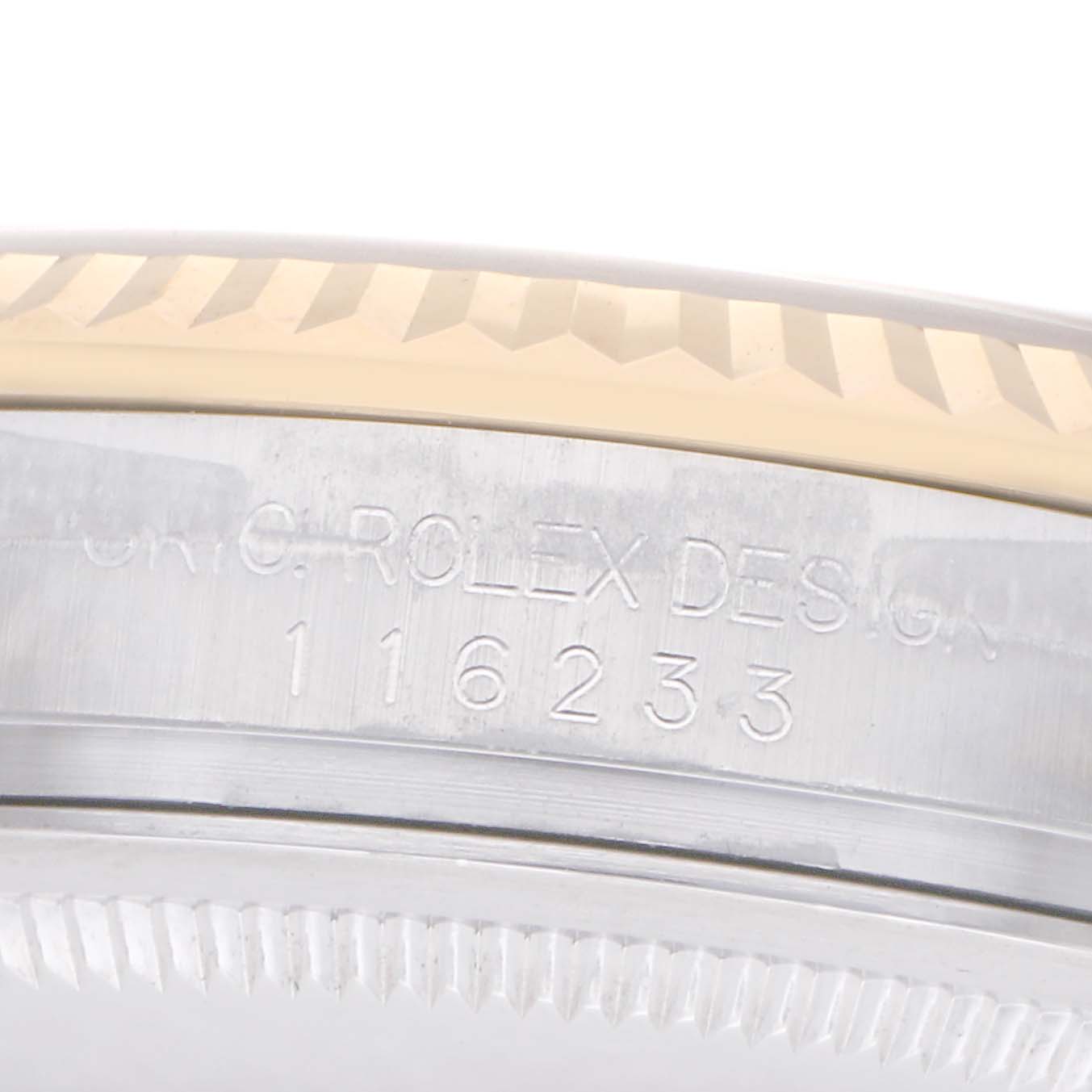 The image shows a close-up of the side of a Rolex Datejust model 116233, highlighting the engraved model number on its case.