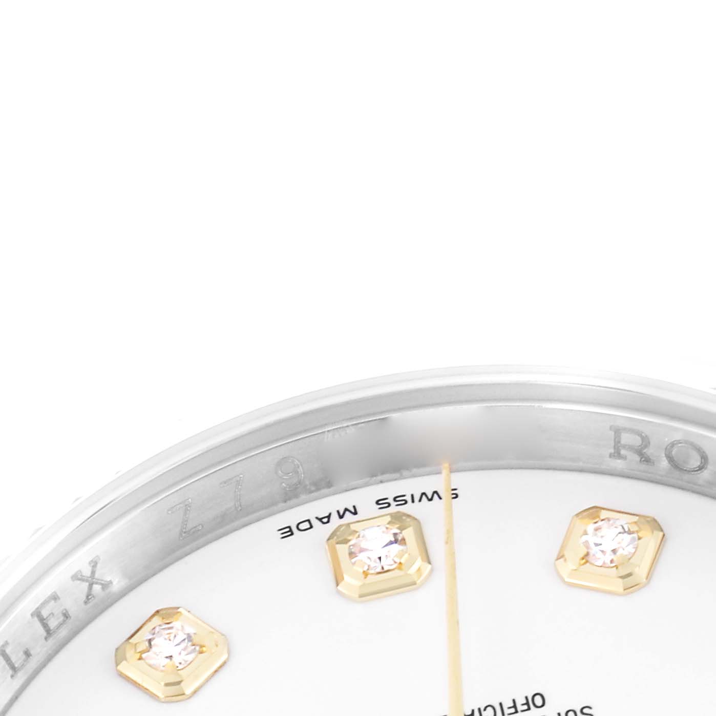 The image shows a close-up of the Rolex Datejust model 116233 watch face, highlighting the bezel, part of the dial with diamond markers, and the minute hand.