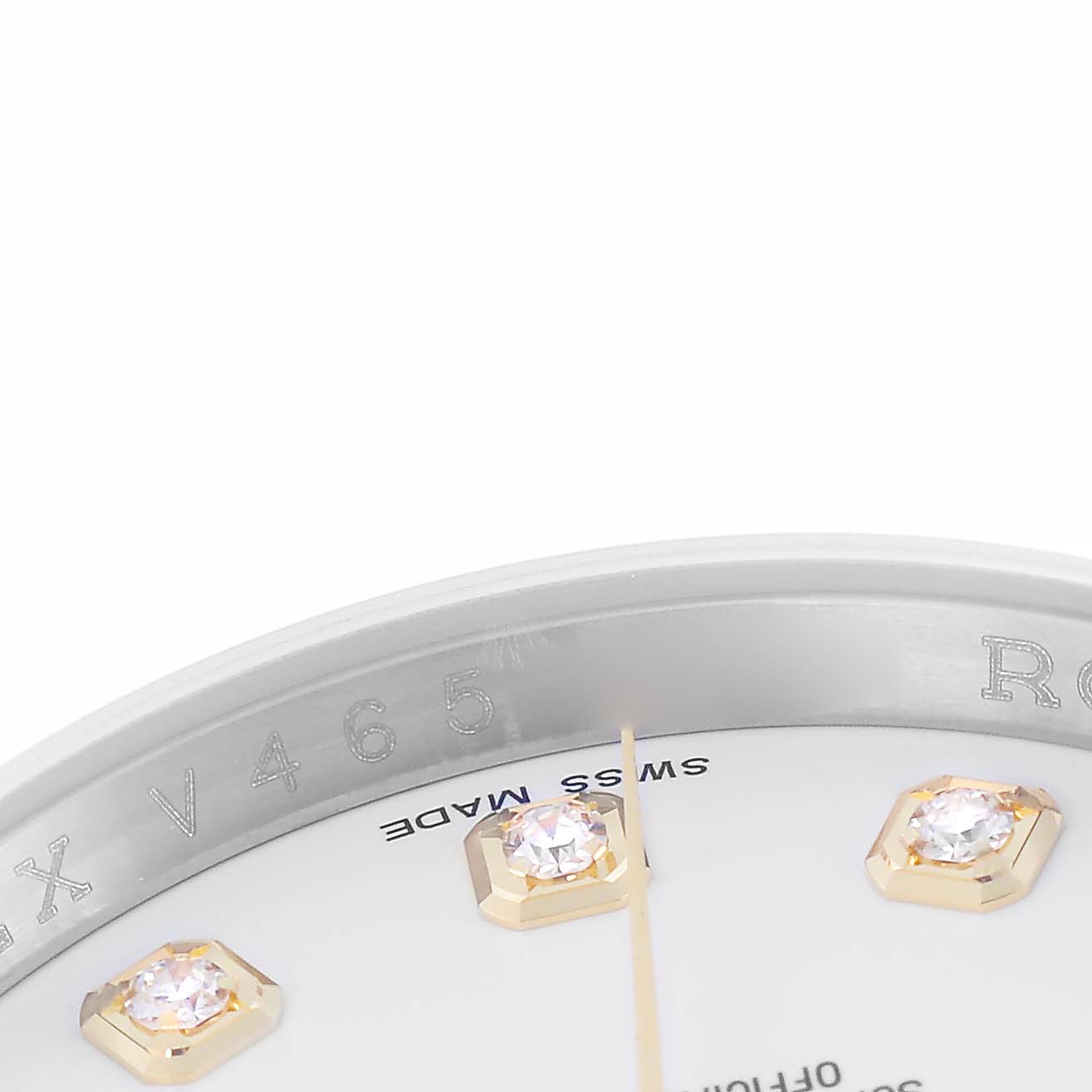 The image shows a close-up of the Rolex Datejust model 116233, focusing on part of the bezel and dial with diamond markers and "Swiss Made" text.