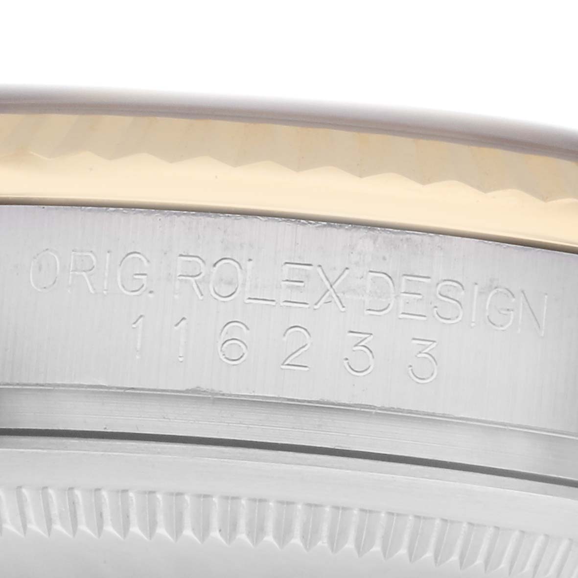 The image shows a close-up of the side of a Rolex Datejust 116233 watch, highlighting the engraved model number and "ORIG. ROLEX DESIGN" inscription.