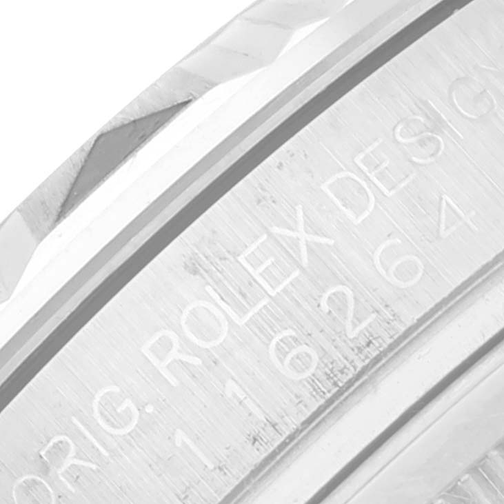 This is a close-up view of the case side of a Rolex Turn-o-Graph 116264 Men's Stainless Steel Blue Dial 116264 Men's Stainless Steel Blue Dial watch, showing engraved text and part of the bezel.