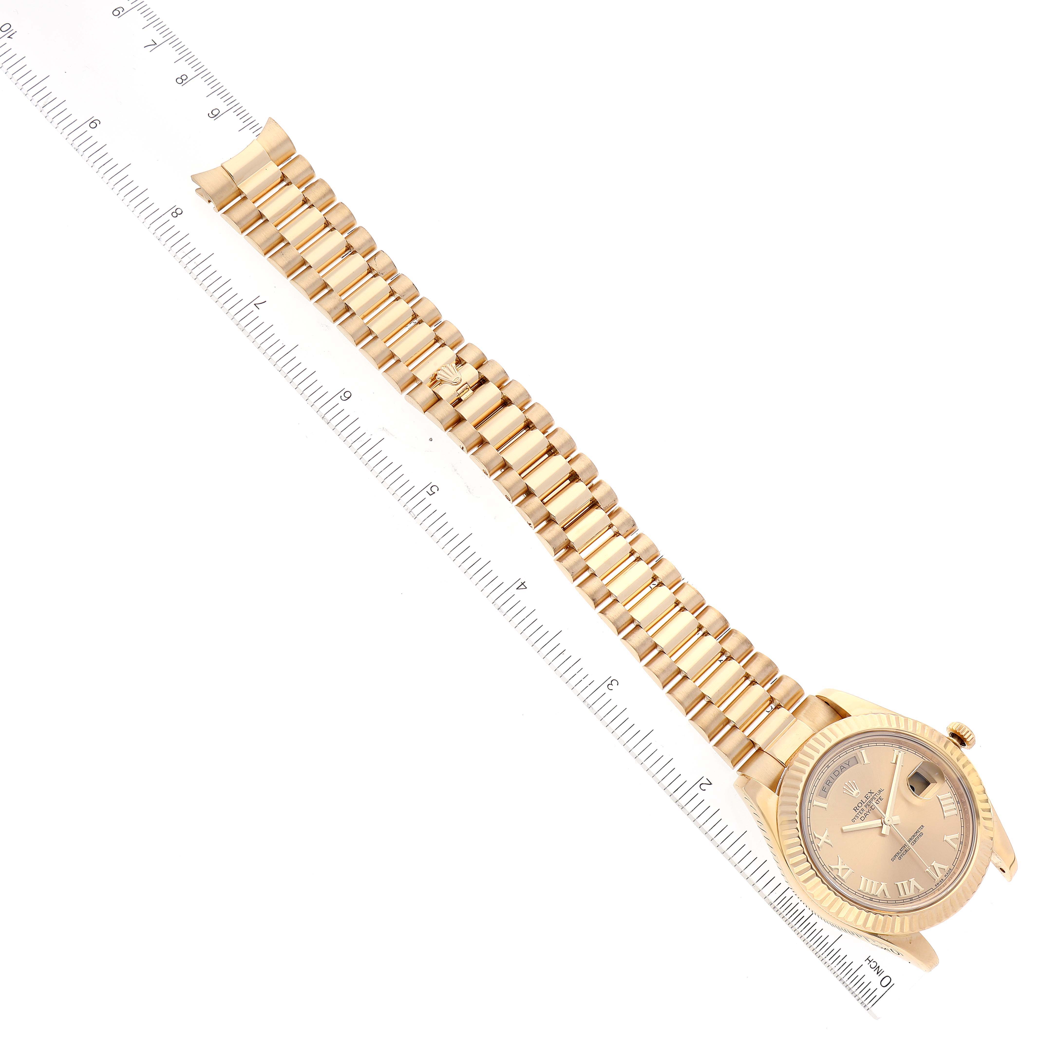 This image shows a Rolex President 218238 Men
s Yellow Gold Champagne Dial 218238 Men
s Yellow Gold Champagne Dial model watch lying flat, highlighting its gold bracelet and face with Roman numerals.