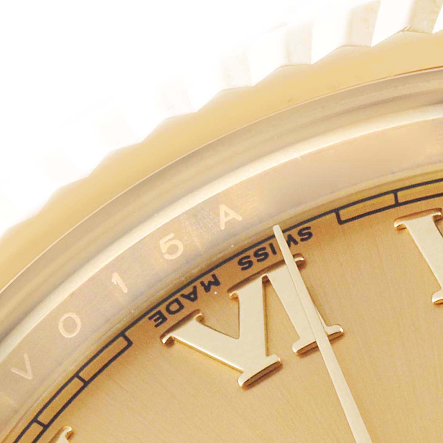 This image shows a close-up of the dial and bezel of a Rolex President 218238 Men
s Yellow Gold Champagne Dial 218238 Men
s Yellow Gold Champagne Dial model watch, highlighting the Roman numeral hour markers and text.