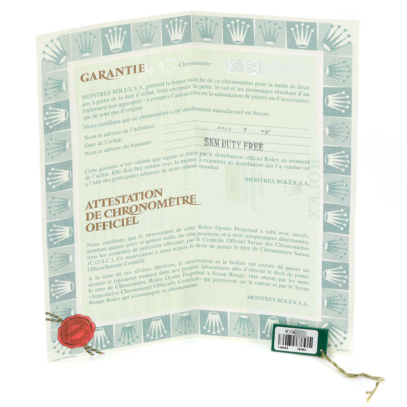 The image shows a warranty certificate and chronometer attestation for the Rolex Daytona 116523 Men
s Steel and Gold (two tone) Champagne Dial 116523 Men
s Steel and Gold (two tone) Champagne Dial watch.