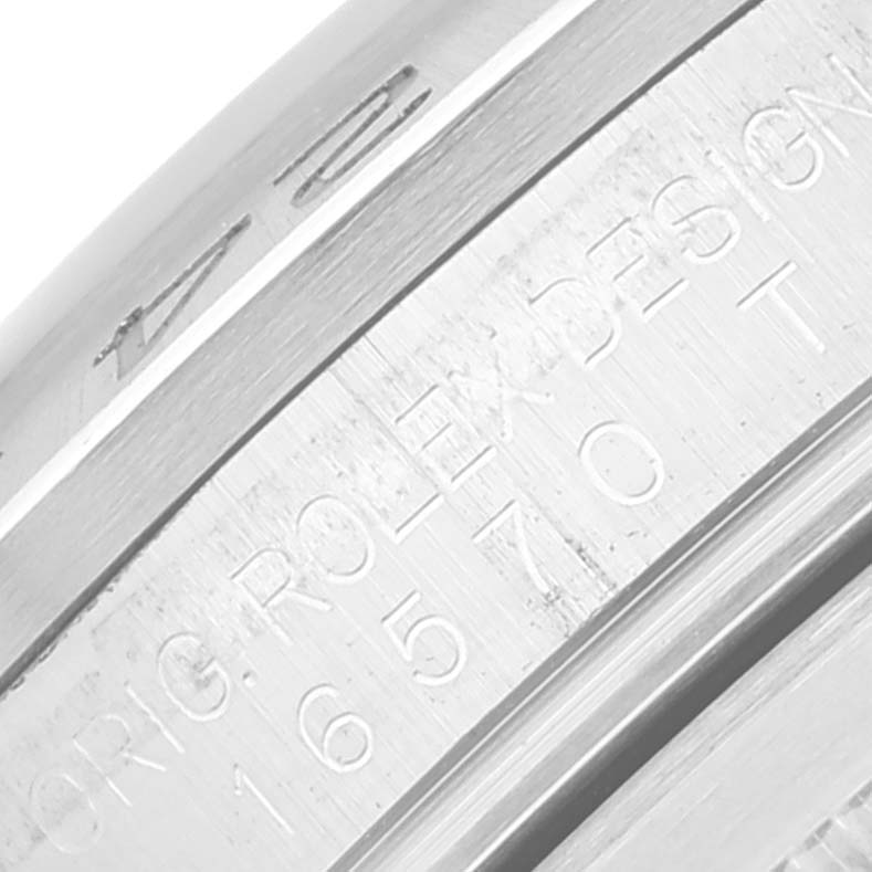 This is a close-up of the inner bezel and case rim of the Rolex Explorer 16570T Men
s Stainless Steel Black Dial 16570T Men
s Stainless Steel Black Dial watch, showcasing engraved markings.