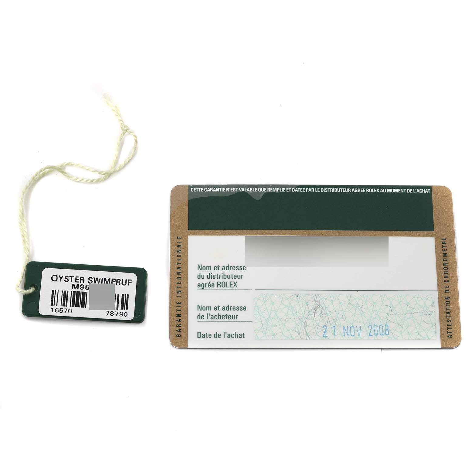 The image shows the warranty card and tag for a Rolex Explorer 16570T Men
s Stainless Steel Black Dial 16570T Men
s Stainless Steel Black Dial model, with details and a barcode on the tag.