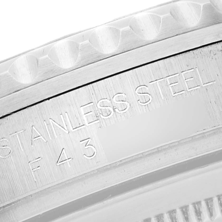 The image shows a close-up of the stainless steel bezel and part of the engraving on a Rolex GMT-Master 16710 Men's Stainless Steel Black Dial 16710 Men's Stainless Steel Black Dial watch.