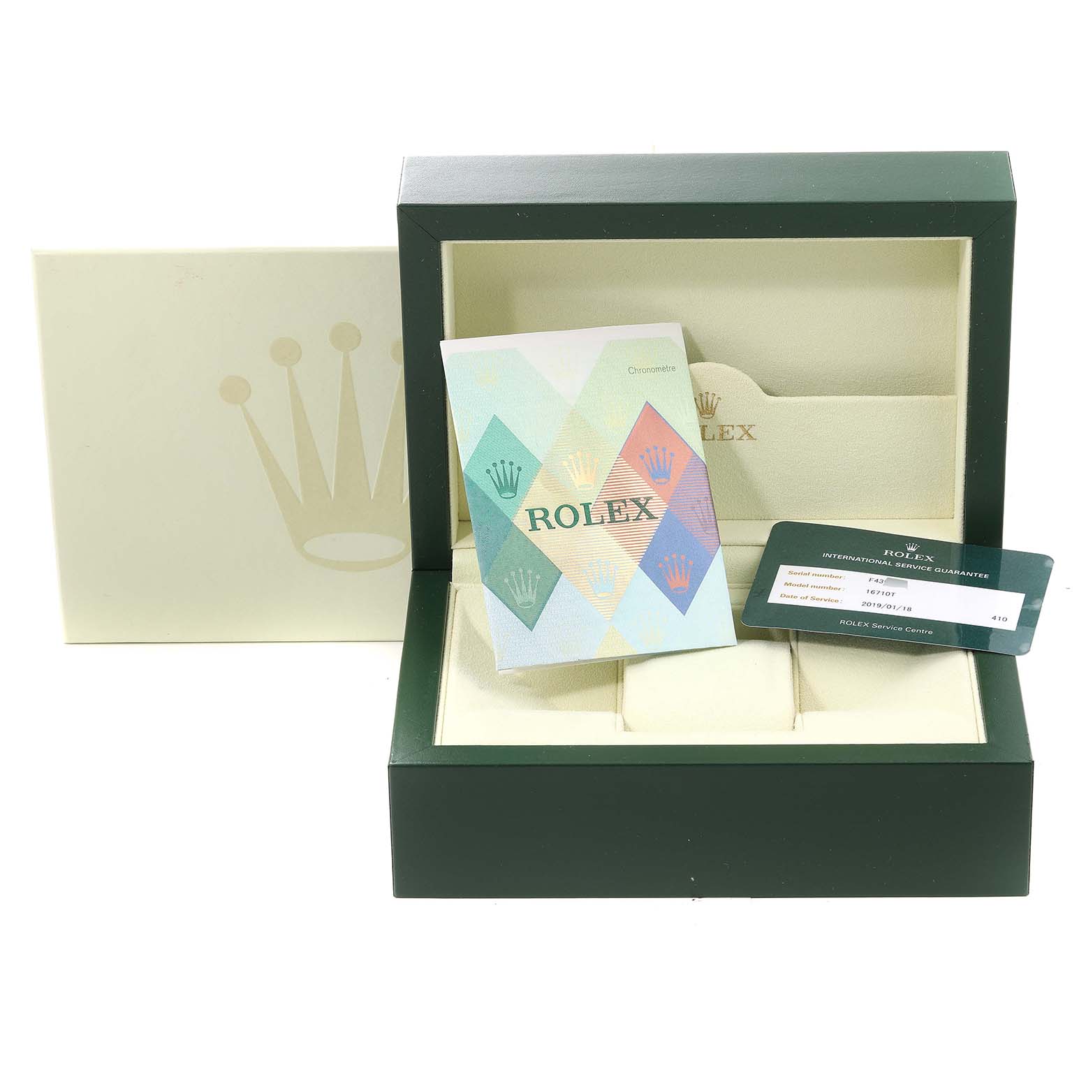 This image shows an open Rolex box with a warranty card, booklet, and the inner packaging for the GMT-Master model.