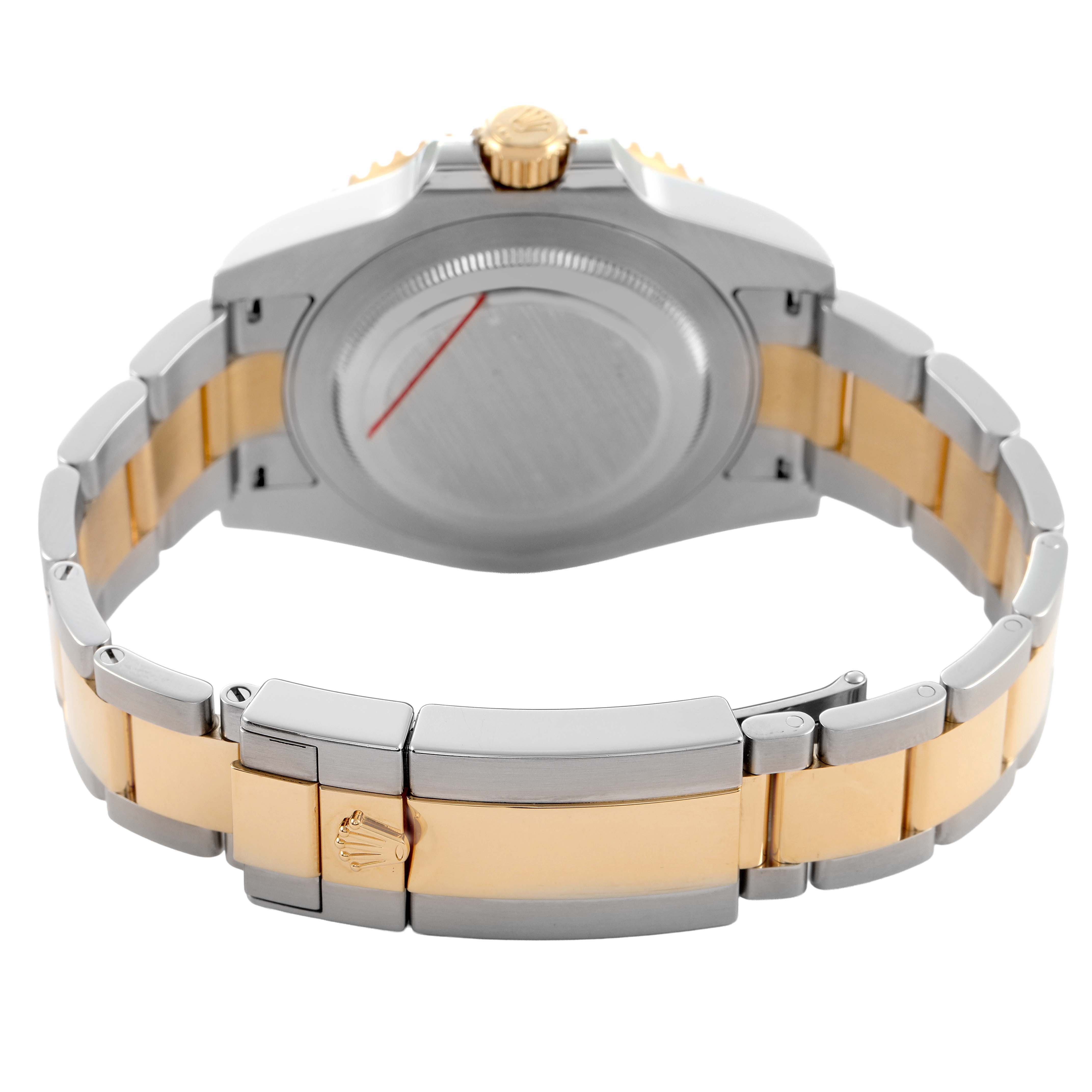 The image shows the back case and bracelet of a Rolex GMT-Master 116713LN Men's Steel and Gold (two tone) Black Dial, highlighting its two-tone metal design and clasp.