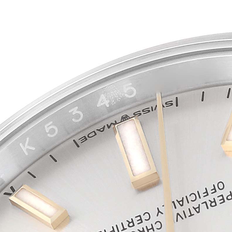 This close-up image of the Rolex Oyster Perpetual 124200 Men's Stainless Steel Silver Dial 124200 Men's Stainless Steel Silver Dial watch shows a portion of the dial, markers, and hands at an angle.
