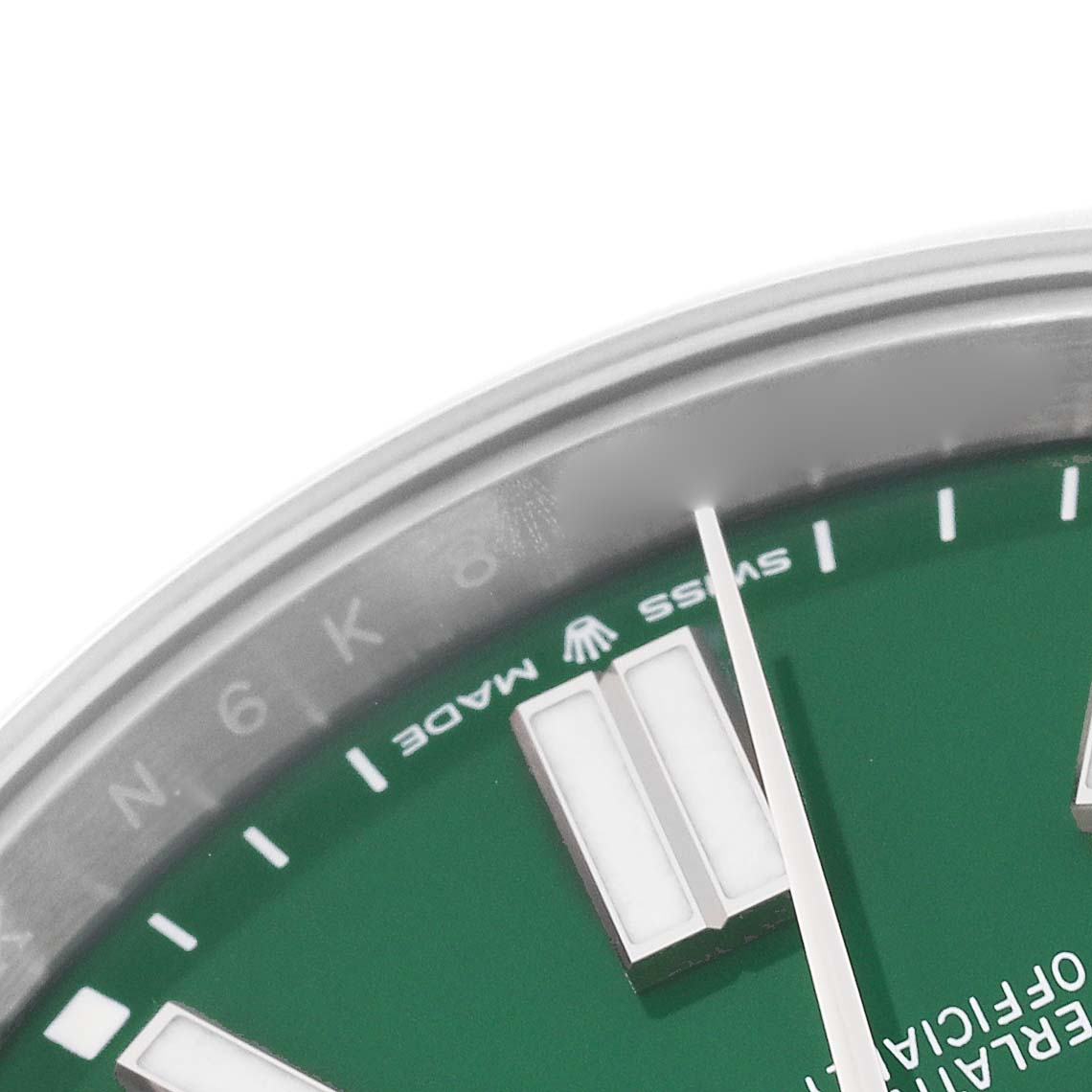 This close-up image shows the edge of the dial and hour markers of a Rolex Oyster Perpetual 124300 Men's Stainless Steel Green Dial 124300 Men's Stainless Steel Green Dial watch.