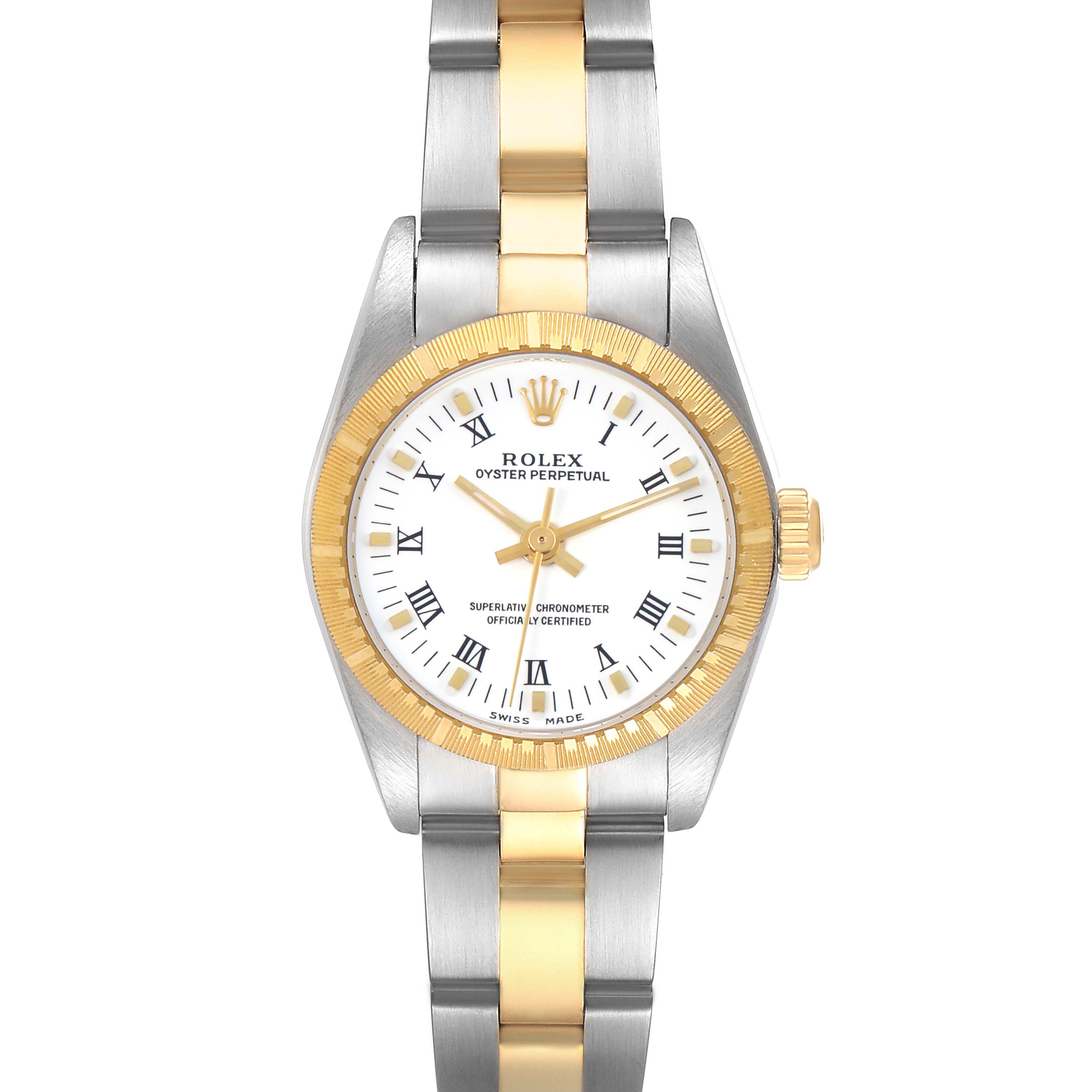 The Rolex Oyster Perpetual model 76243 is shown from a straight-on angle, displaying the watch's face, bezel, and part of the bracelet.