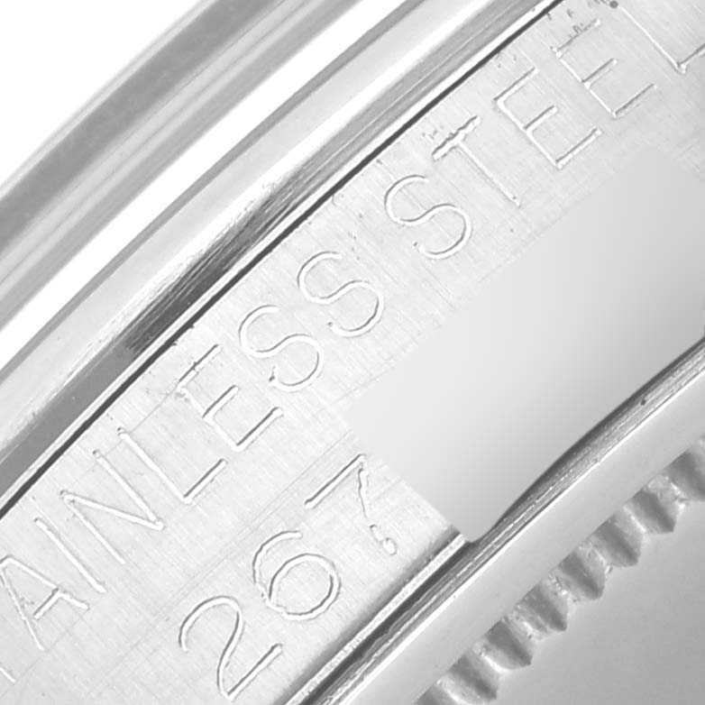 This close-up image shows the engraved stainless steel ring of the Rolex Vintage Collection 6426 Men's Stainless Steel Silver Dial 6426 Men's Stainless Steel Silver Dial watch.