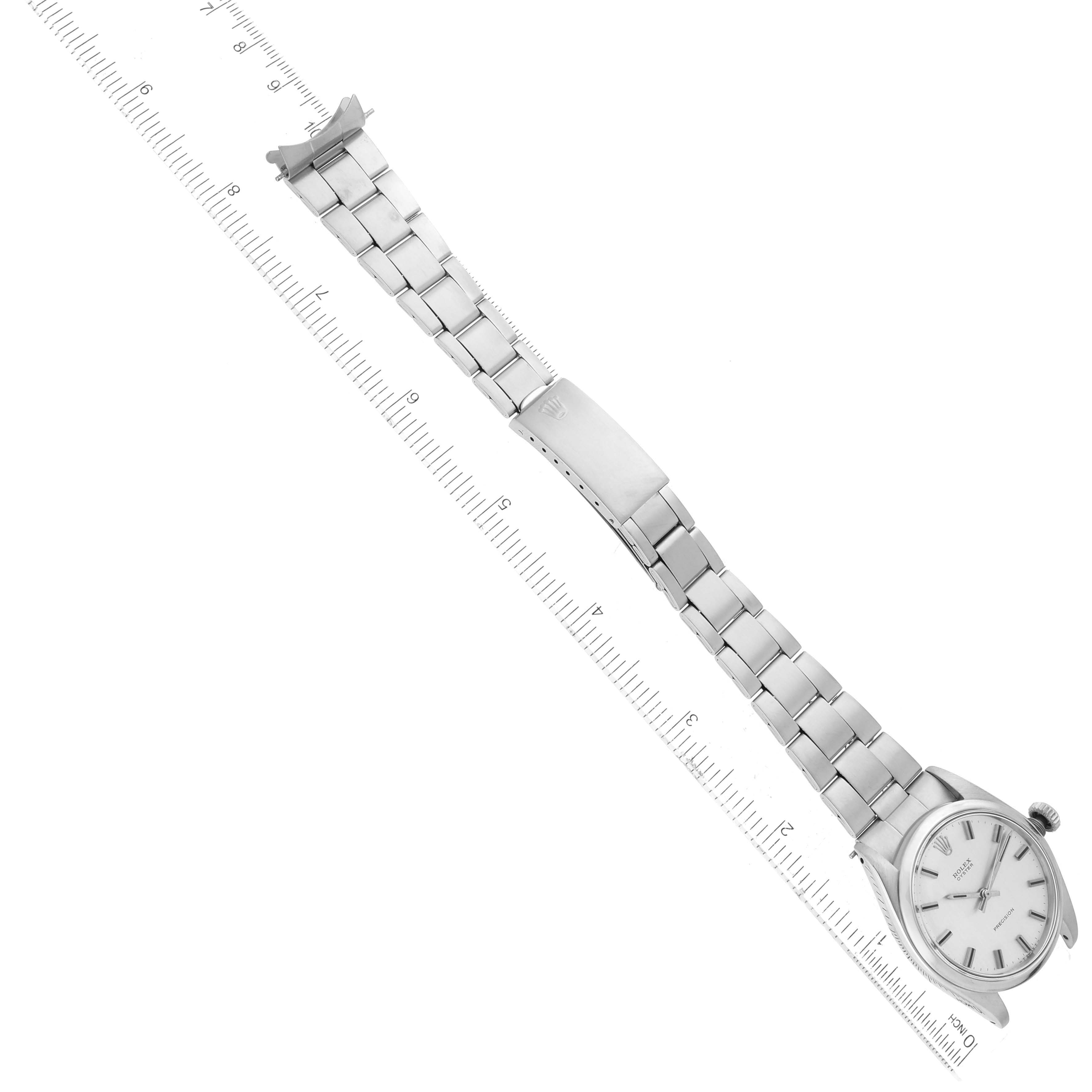 The image shows a Rolex Vintage Collection 6426 Men's Stainless Steel Silver Dial 6426 Men's Stainless Steel Silver Dial model watch, featuring the entire watch and bracelet laid out flat alongside a ruler.