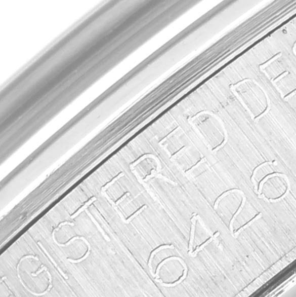 The image shows a close-up of the engraved text on the back case of a Vintage Collection Rolex watch.