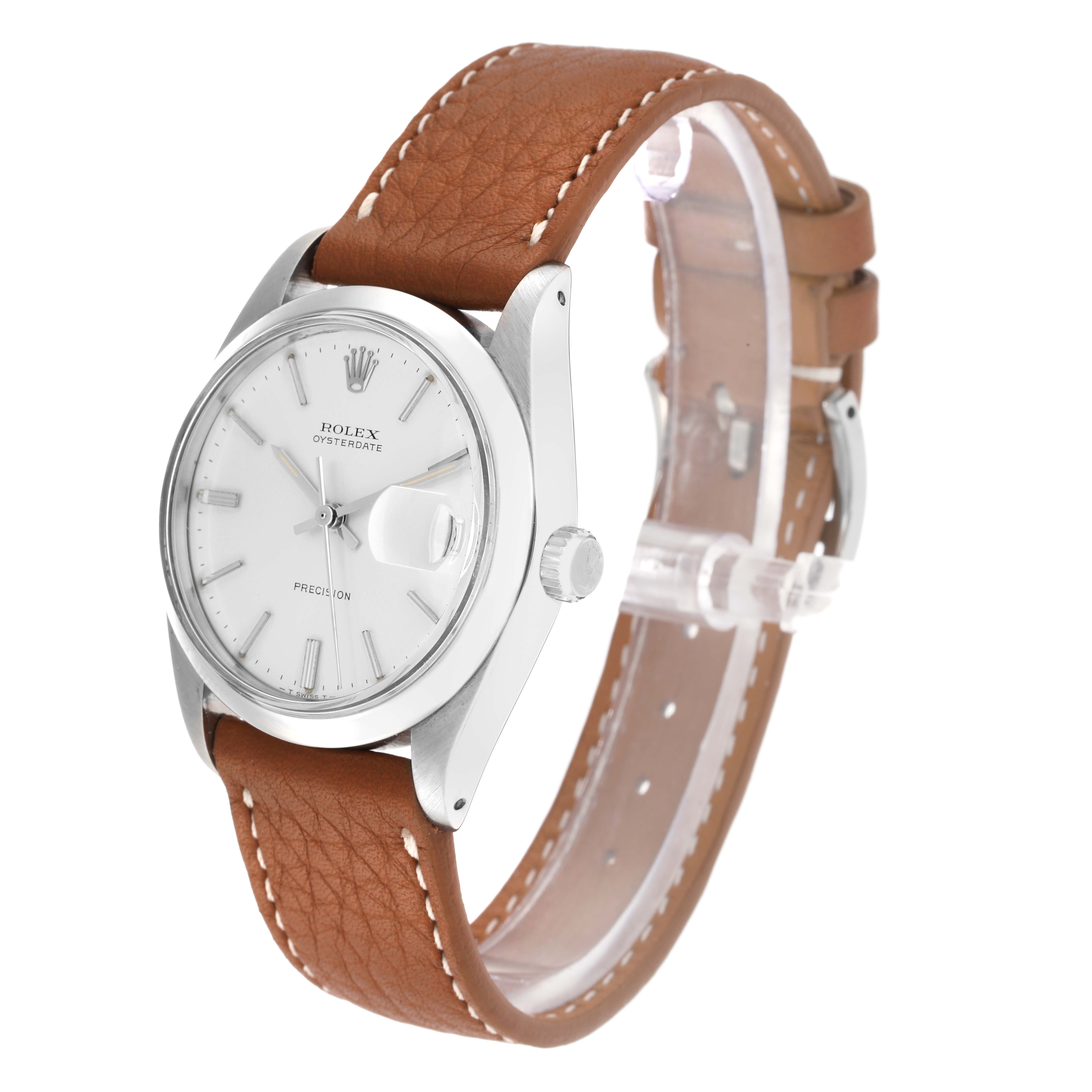 The Rolex Vintage Collection model number 6694 is shown from an angle displaying the dial, case, crown, and brown leather strap.