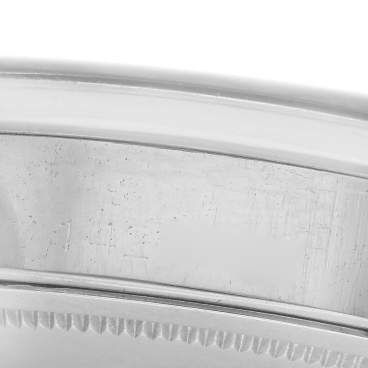 The image shows a close-up side view of the case edge and part of the bezel of the Rolex Vintage Collection model 6694 men
s watch.