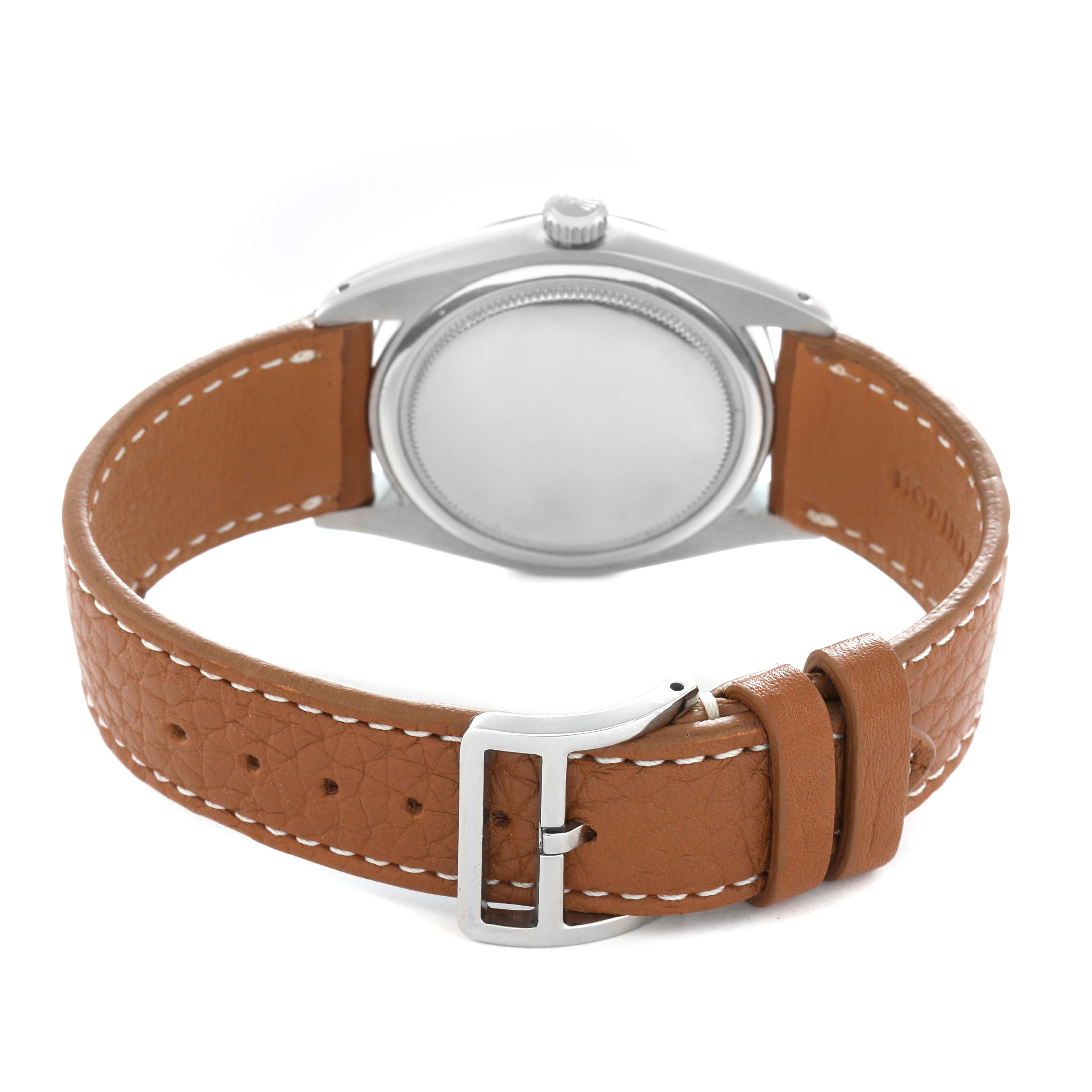 The image shows the back and side of a Rolex Vintage Collection model number 6694 men
s watch, highlighting its case back, crown, and brown leather strap.