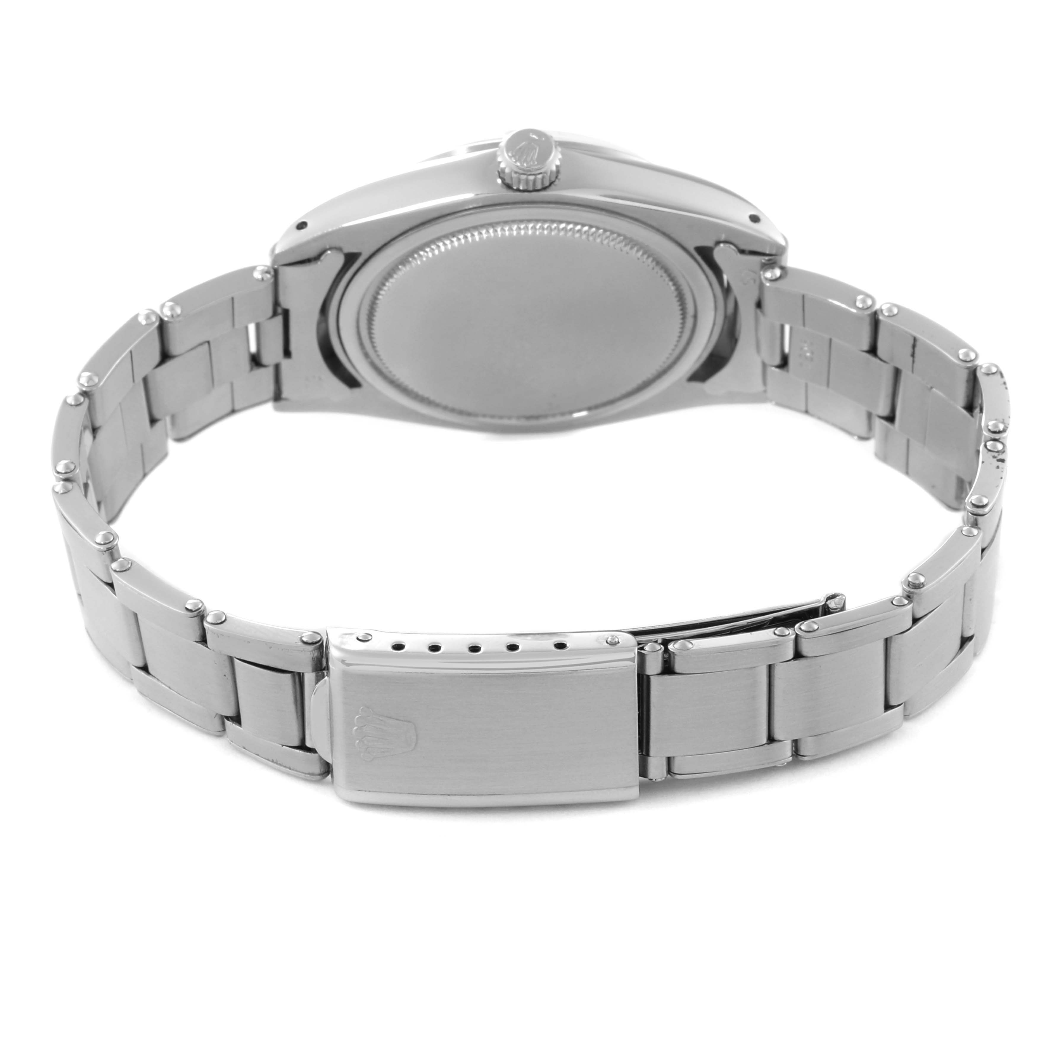 This image shows the underside and clasp of a Vintage Collection Rolex watch, focusing on the bracelet and case back.
