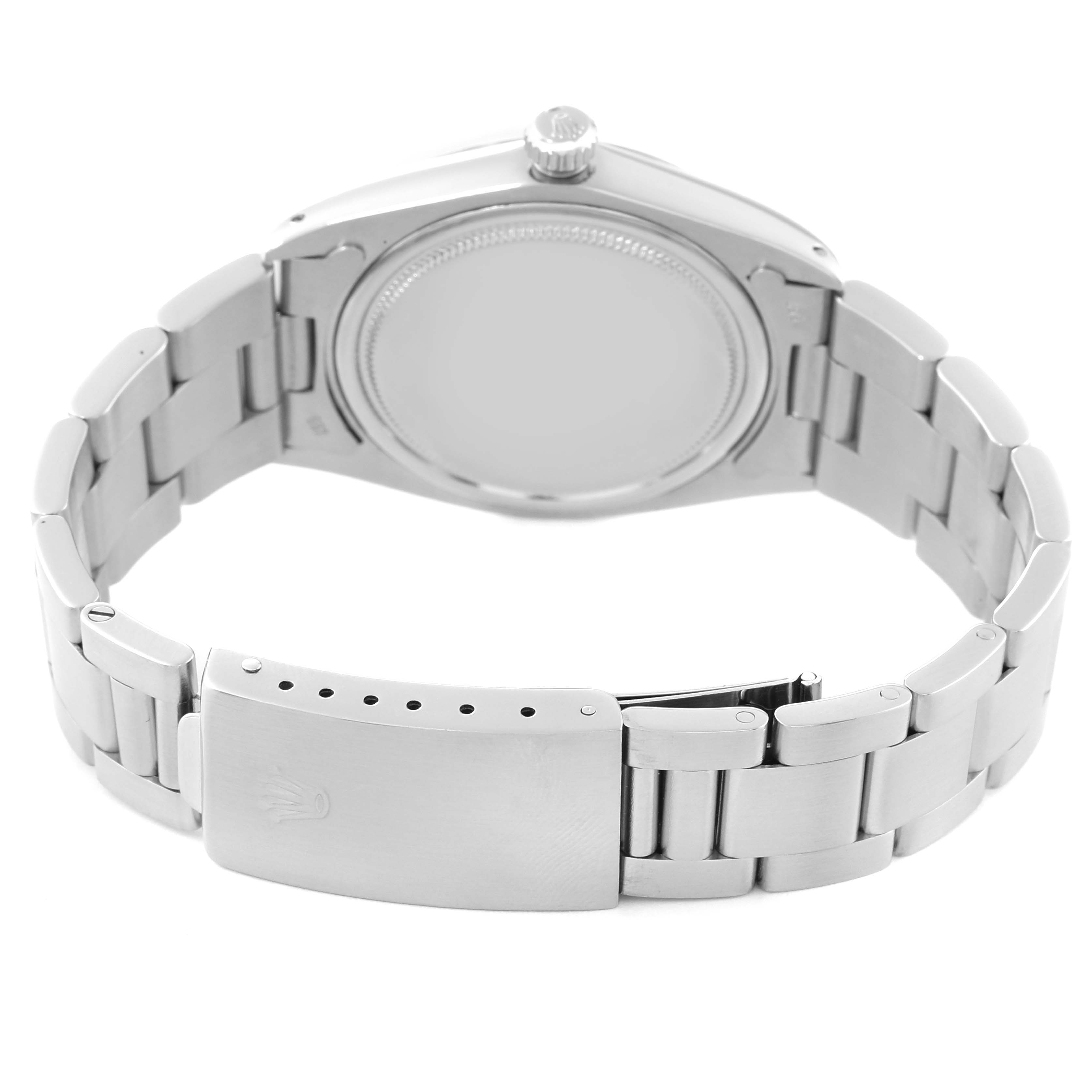 The image shows the backside and clasp of a Vintage Collection model by Rolex, highlighting the bracelet and case back.