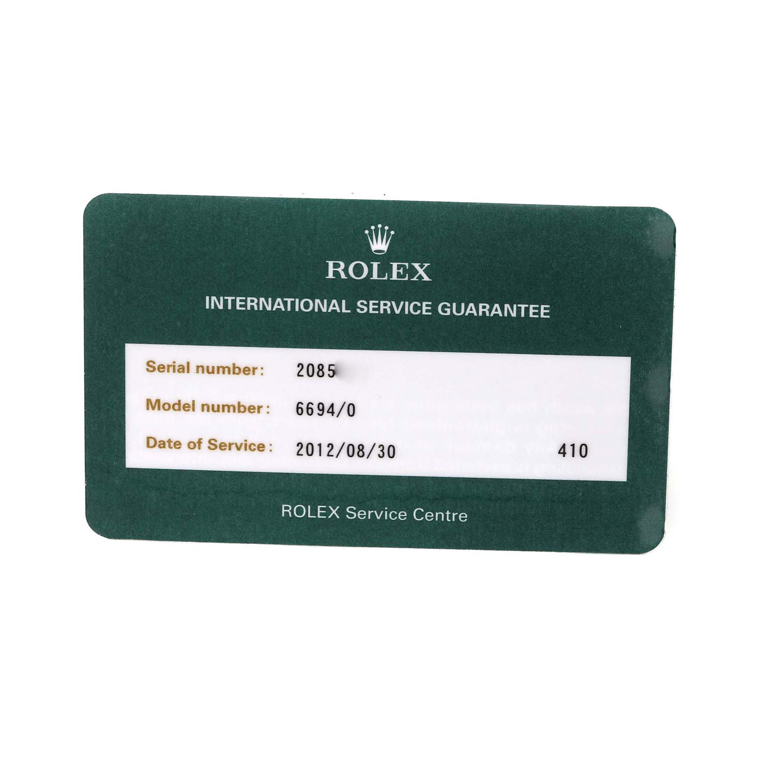 The image shows an angled view of an International Service Guarantee card for the Vintage Collection model by Rolex.