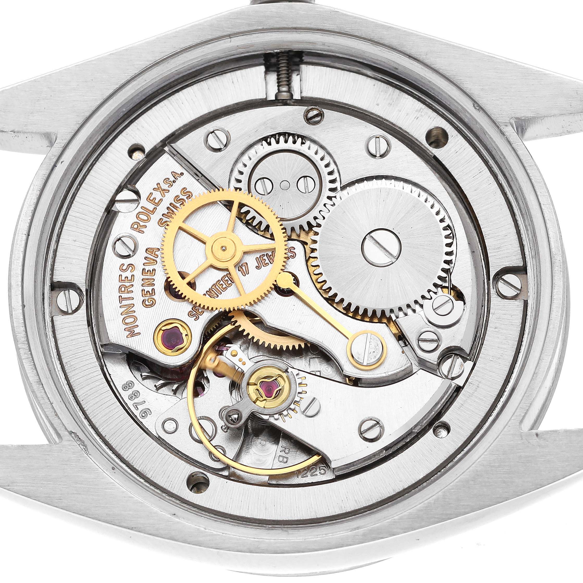 The image shows an internal view of the Rolex Vintage Collection 6694 Men's Stainless Steel Silver Dial 6694 Men's Stainless Steel Silver Dial watch mechanism, highlighting gears and intricate components.